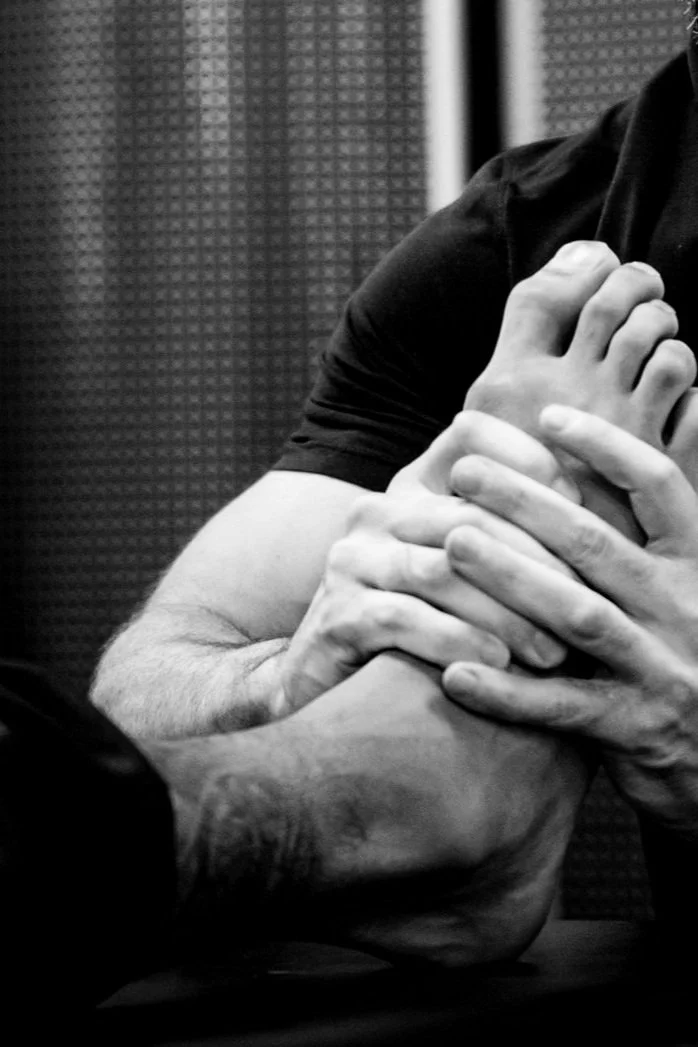 sports PT working on foot
