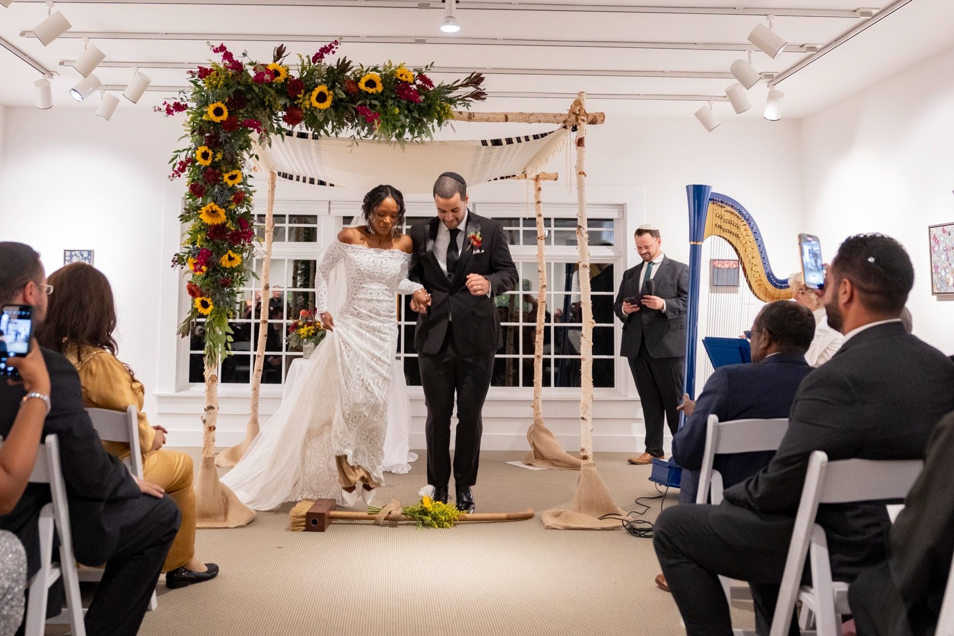 Bride and Groom Jumping Over the Broom