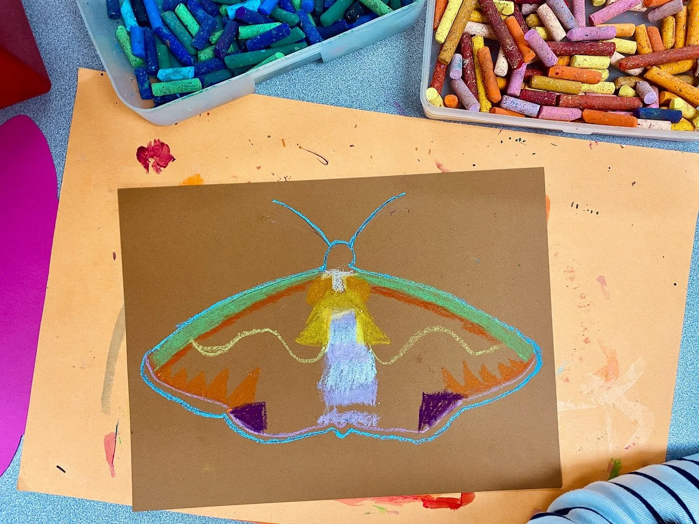 After discussing interesting facts about moths, Art Club looked at the work of artist Rachel Bunteman. 

Students observed the symmetry and texture present in Bunteman&rsquo;s moth paintings. Then using oil pastels, students created their own moth dr