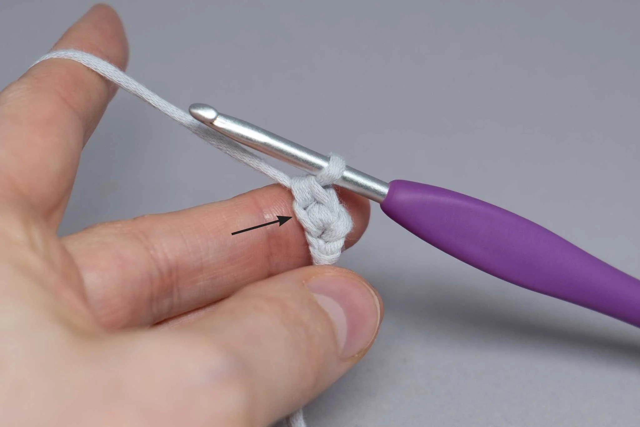  4. Yarn over and pull up through  both  loops on the hook. Your piece should look like this. Highlighted is the ch you will stitch into in step 5. 