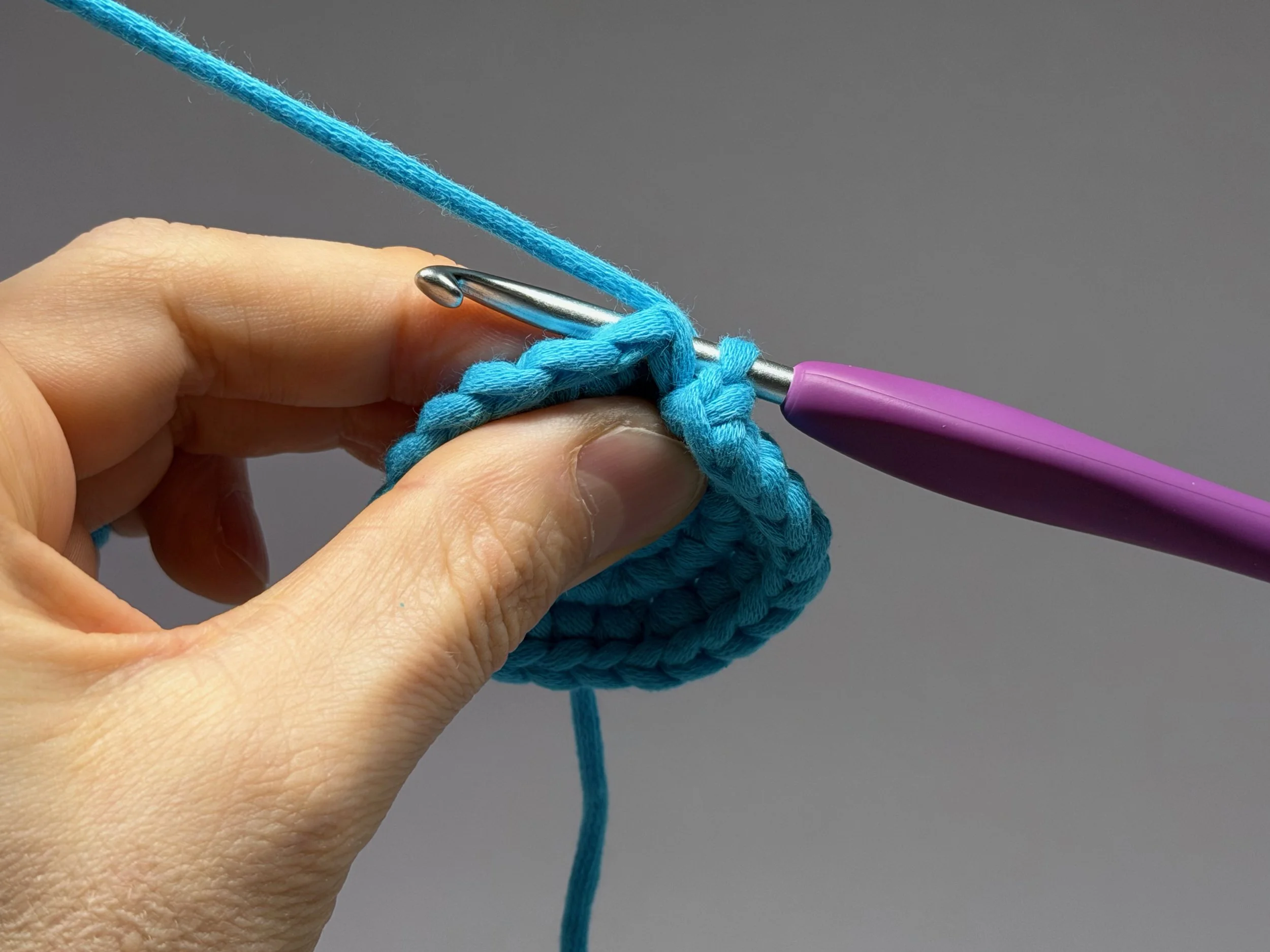  Wrap your hook around the back post and insert through the front of the next stitch 