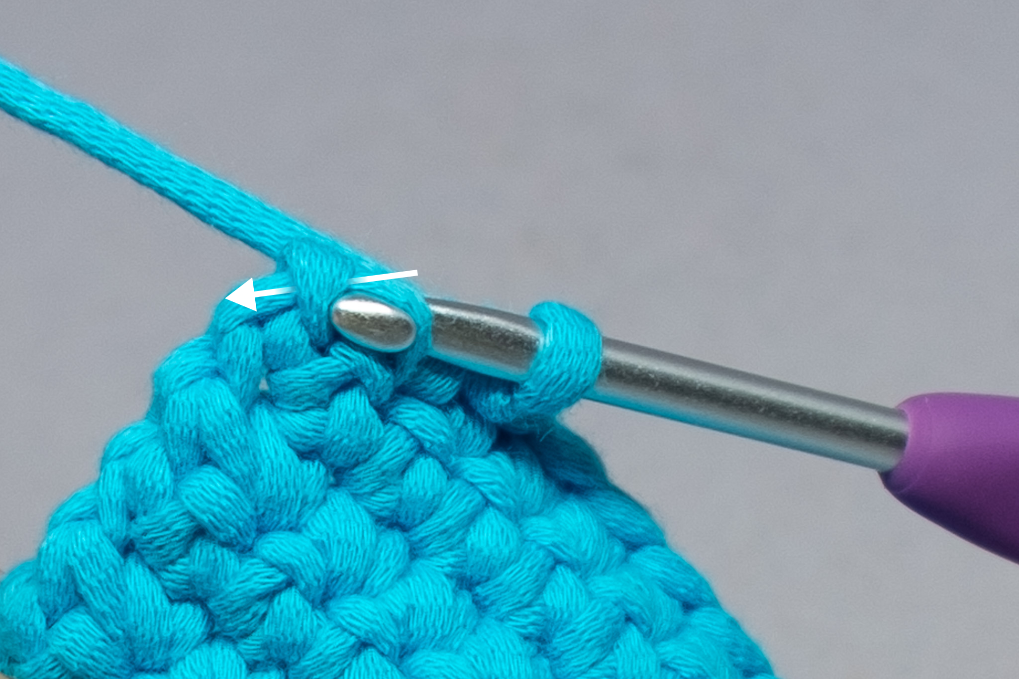  Find the bump from the chain of the previous row and insert your hook through. You will have 3 loops on your hook. 