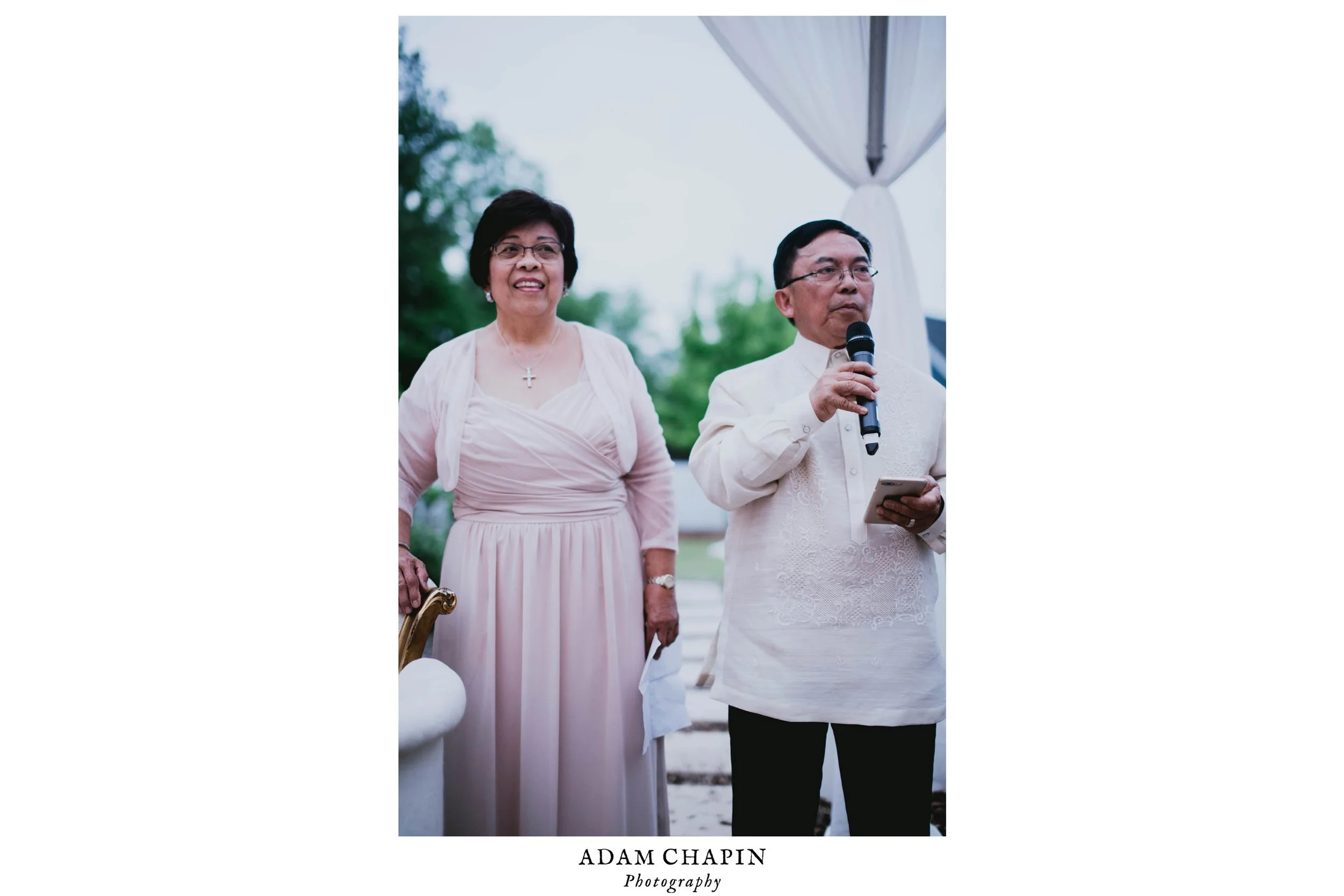 grooms mother and father sharing some kind words and advice before dinner