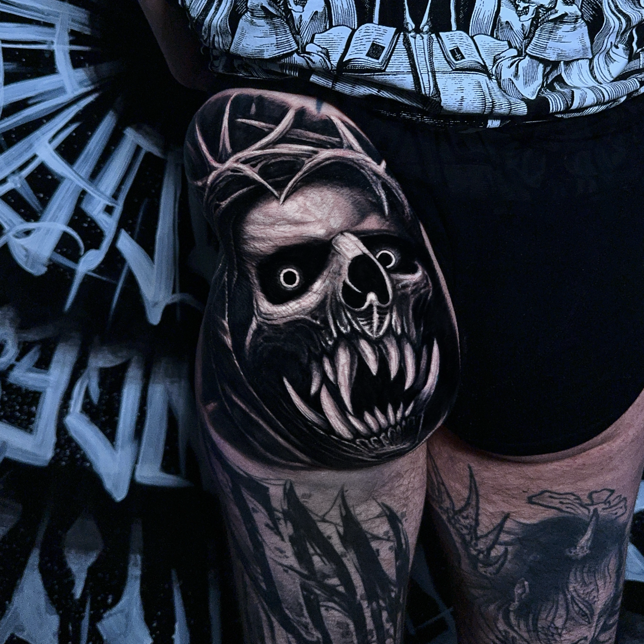 Dark style tattoo of a demon done on a butt cheek