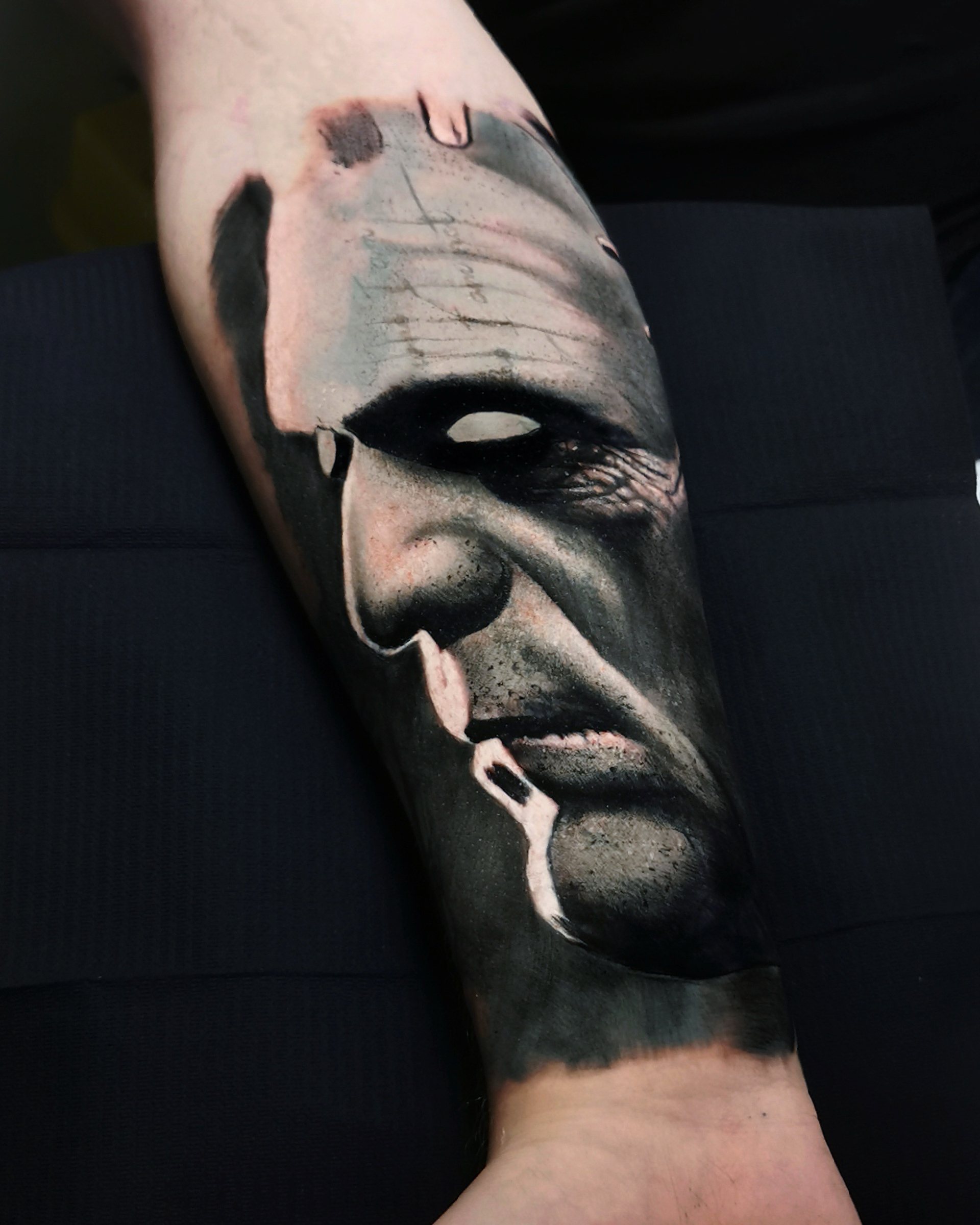 Dark realism tattoo of Frankenstein monster on a lower arm