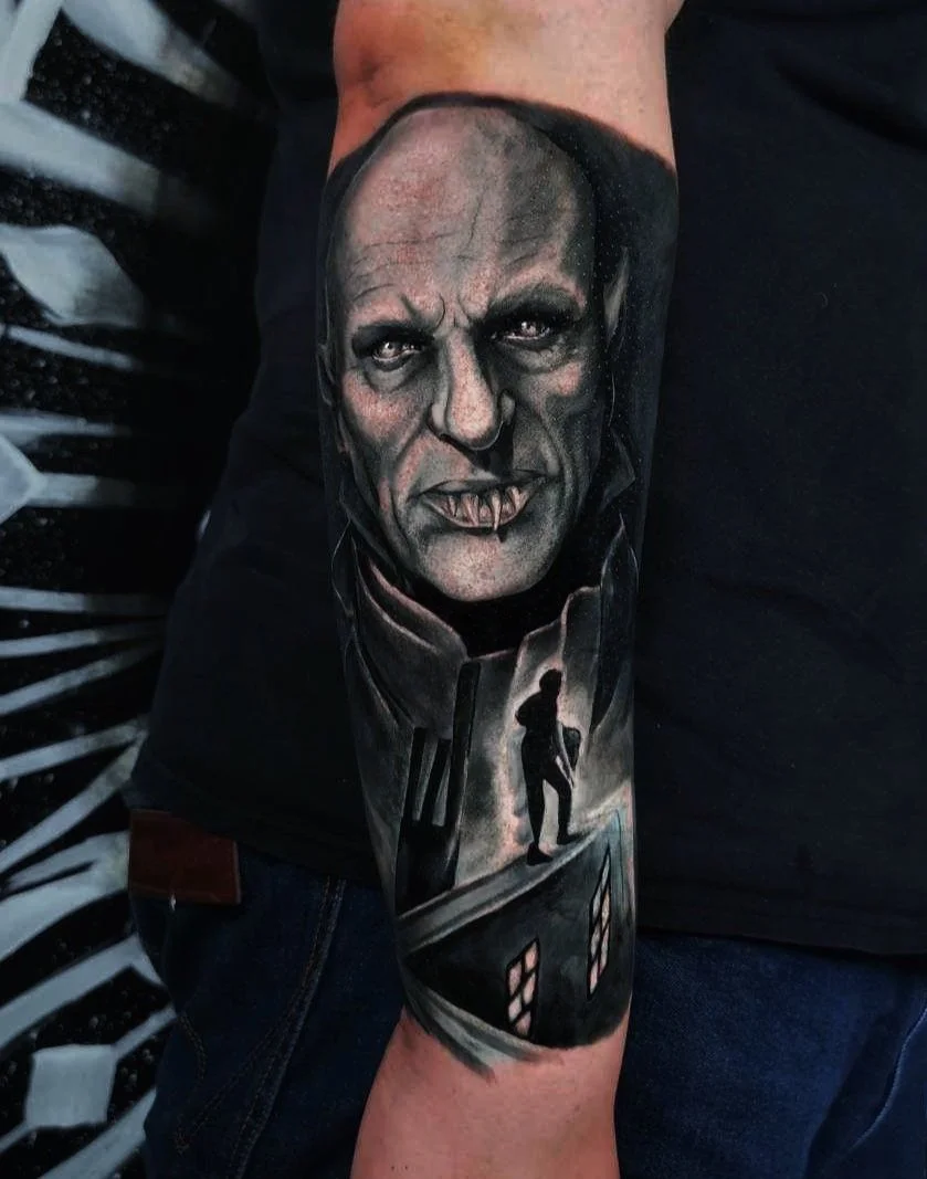Dark realistic portrait tattoo of Nosferatu done on a forearm