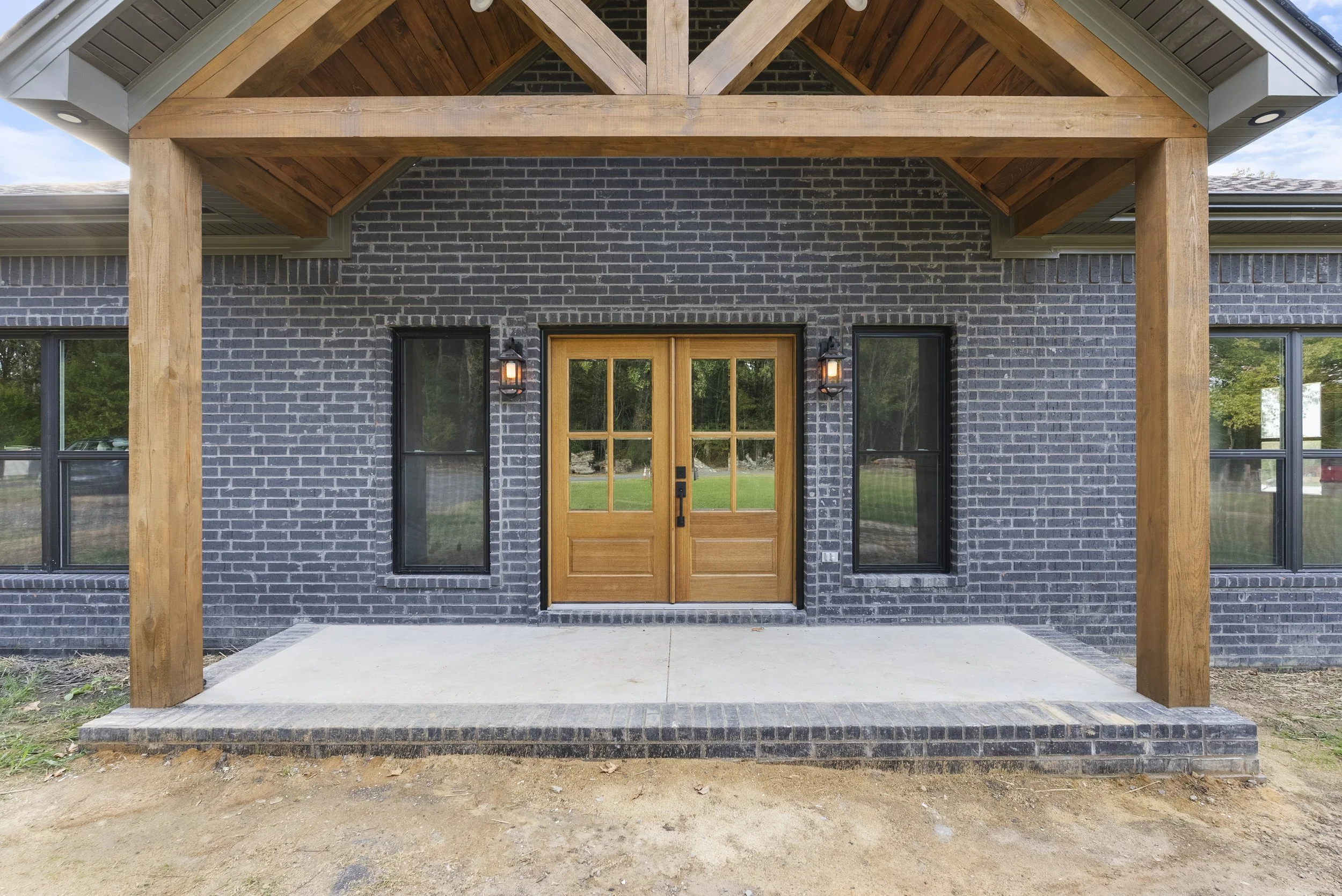 Black modern farmhouse available to build in Cabot, Arkansas.