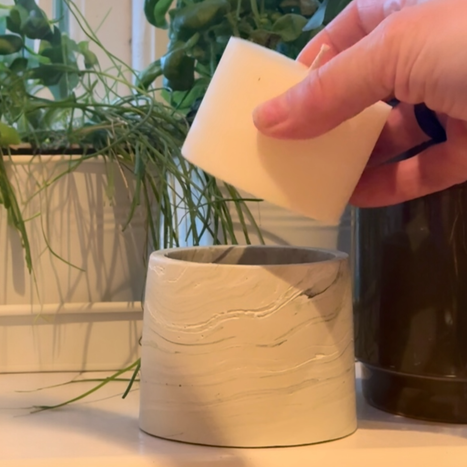 Refilling a refillable candle