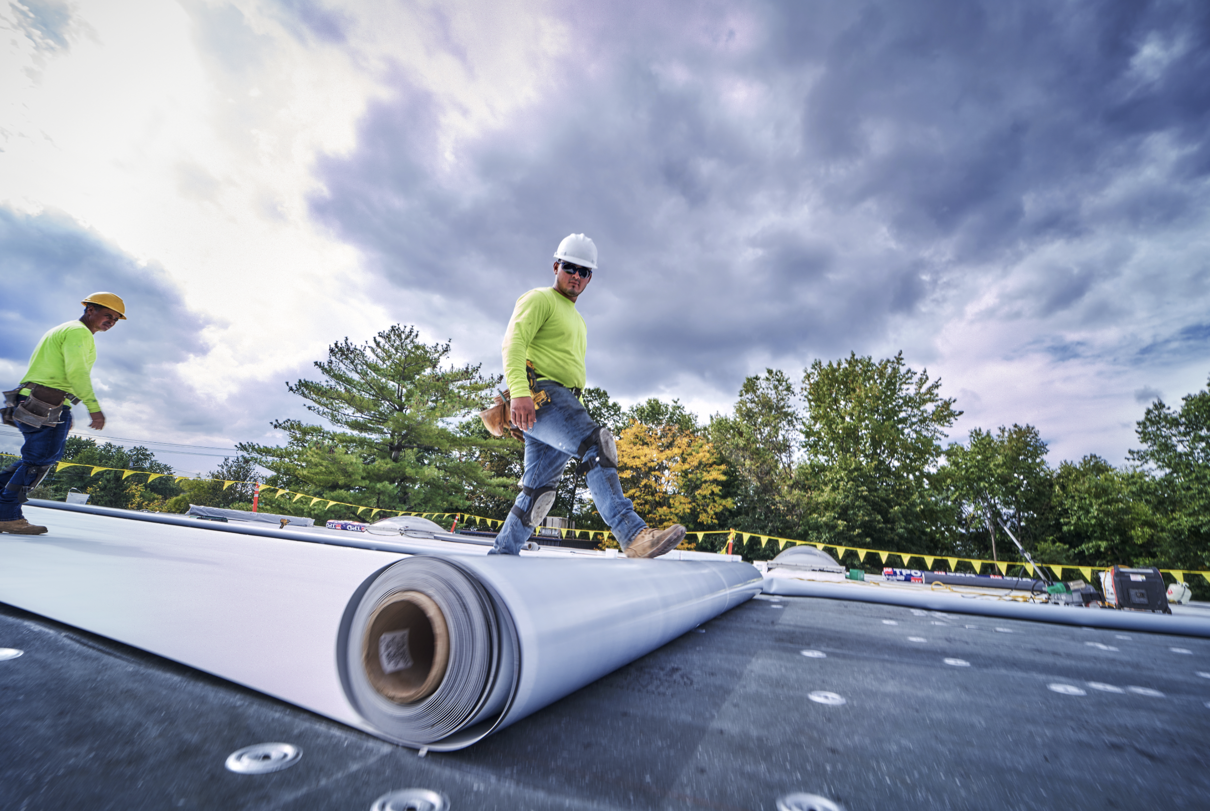 Mechanically fastened base sheet and TPO. Three story building requires hard hat.