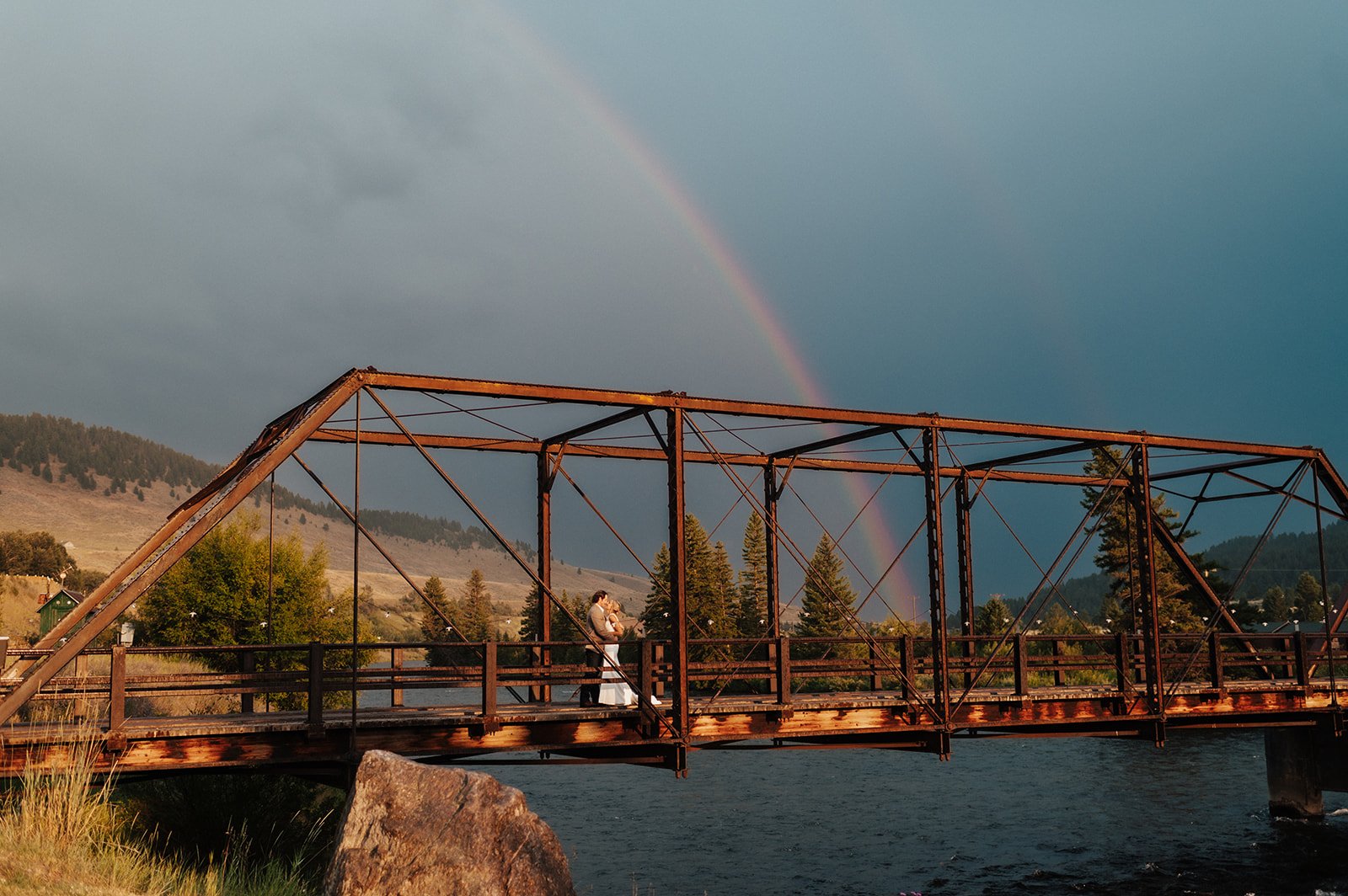 A rainbow over the Hutchins Bridge framing the perfect Yellowstone or Bozeman wedding