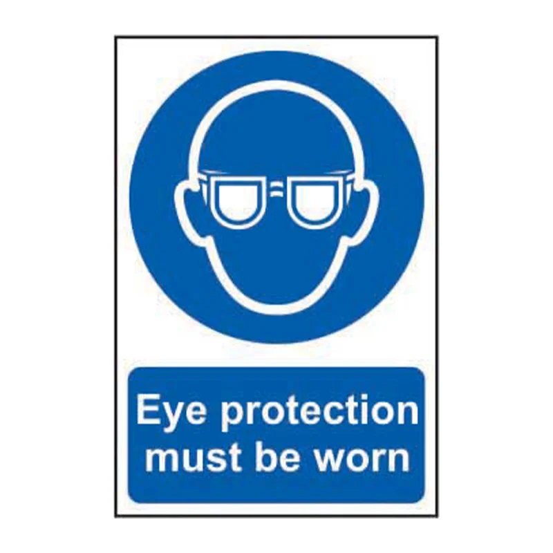 A safety sign indicating that eye protection must be worn, featuring an illustration of a face with safety glasses and text that says, "Eye protection must be worn."