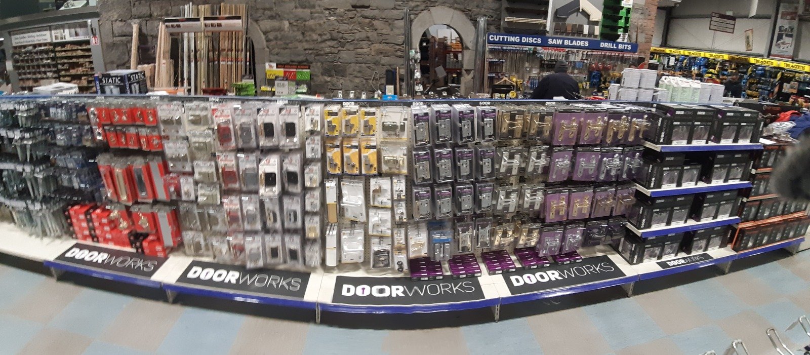 Display of door hardware and locksets in a hardware store aisle.
