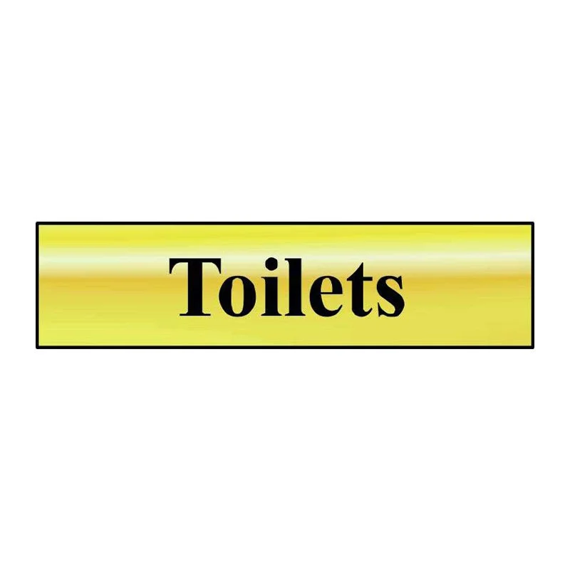 Sign with yellow background and black border reading 'Toilets' in bold black letters.