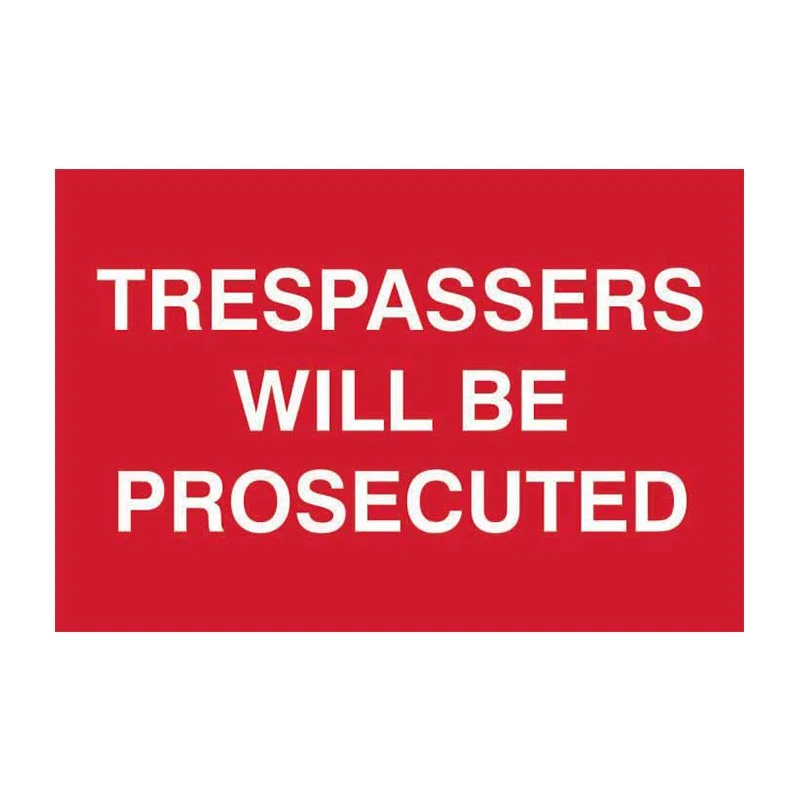 Red sign with white bold text saying 'Trespassers will be prosecuted.'