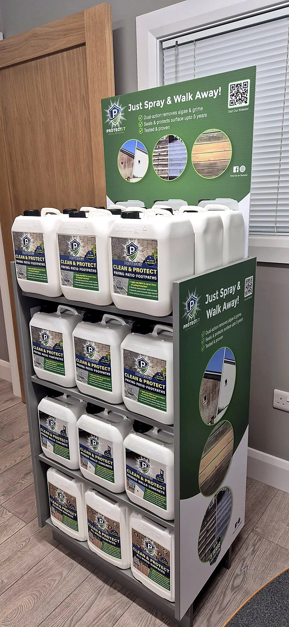 Display rack of containers of cleaning solution with a promotional sign above and beside it describing the product benefits for outdoor surface cleaning.