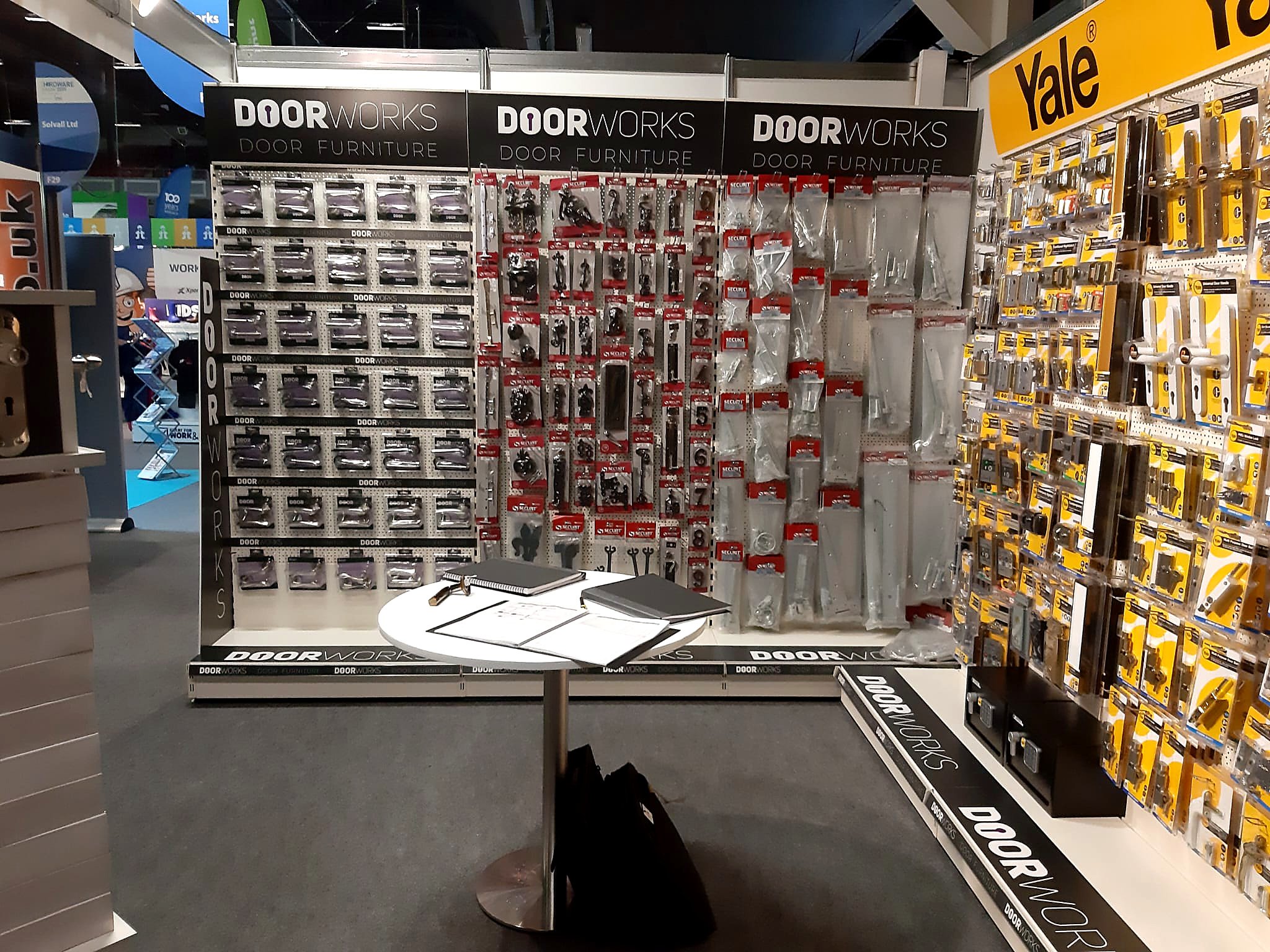 Store display of door hardware, locks, and accessories in a retail store aisle.
