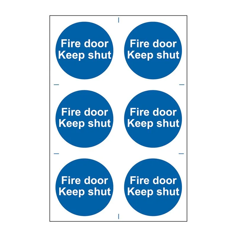 Six blue circular stickers with white text that say 'Fire door Keep shut', arranged in two columns of three.