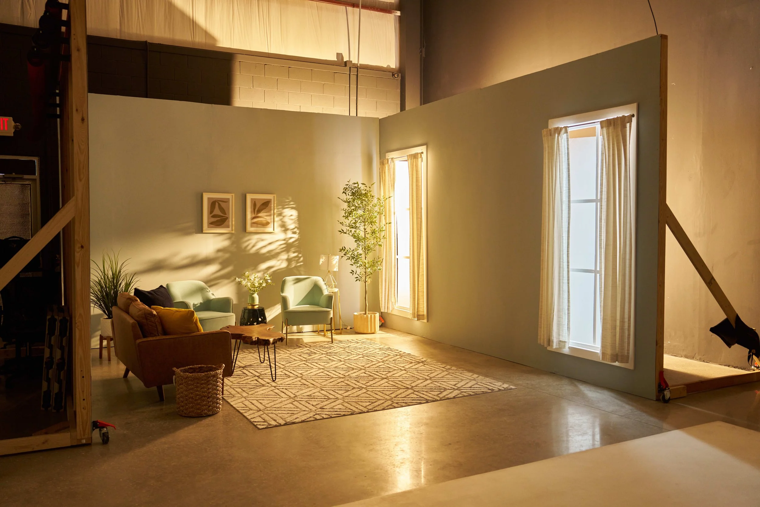 Custom lifestyle living room set design with natural window lighting at Go Bold Studio in Casselberry, FL, available for Orlando commercial photo and video productions.