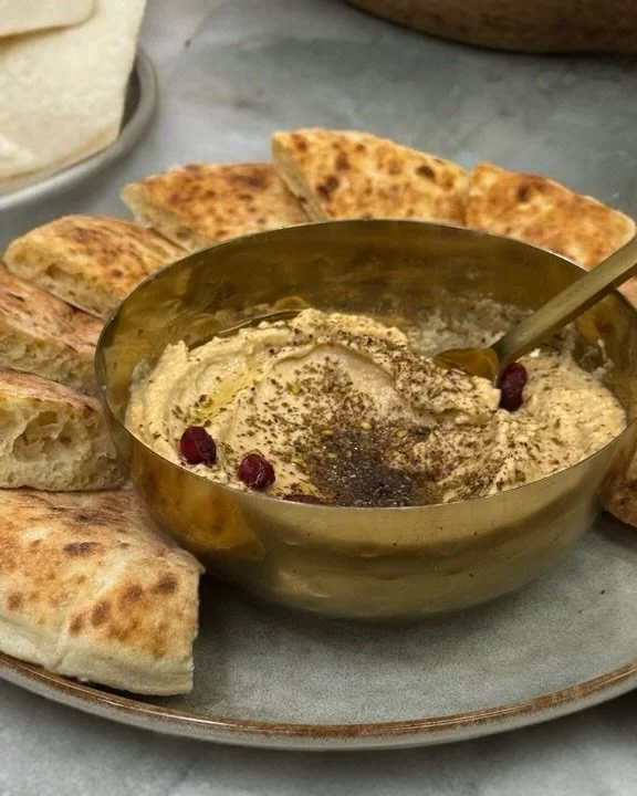 Our hummus isn&rsquo;t just a dip -  it&rsquo;s a family recipe passed down for generations. 
Made fresh in-house every single day, with love, patience, and the perfect blend of chickpeas, tahini, garlic, and lemon.
Come taste the story🧄🍋✨
#TheGril