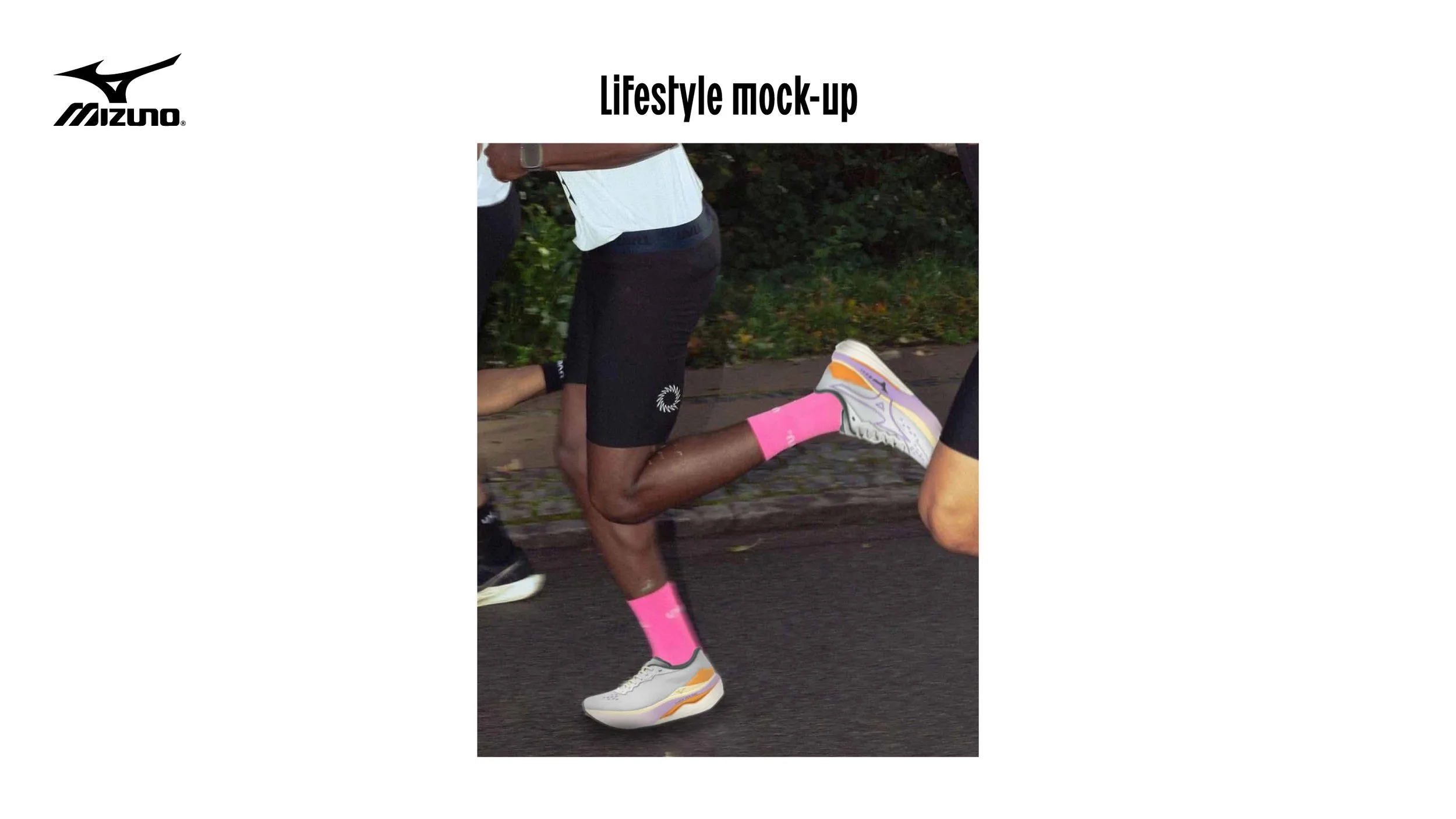 A person running, wearing pink socks and white athletic shoes, part of a lifestyle mock-up for Mizuno brand.