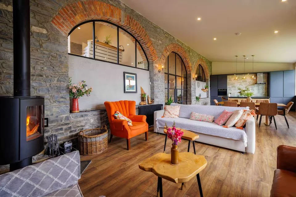 The main sitting area with wood-buring stove at Queenie's Lodge.