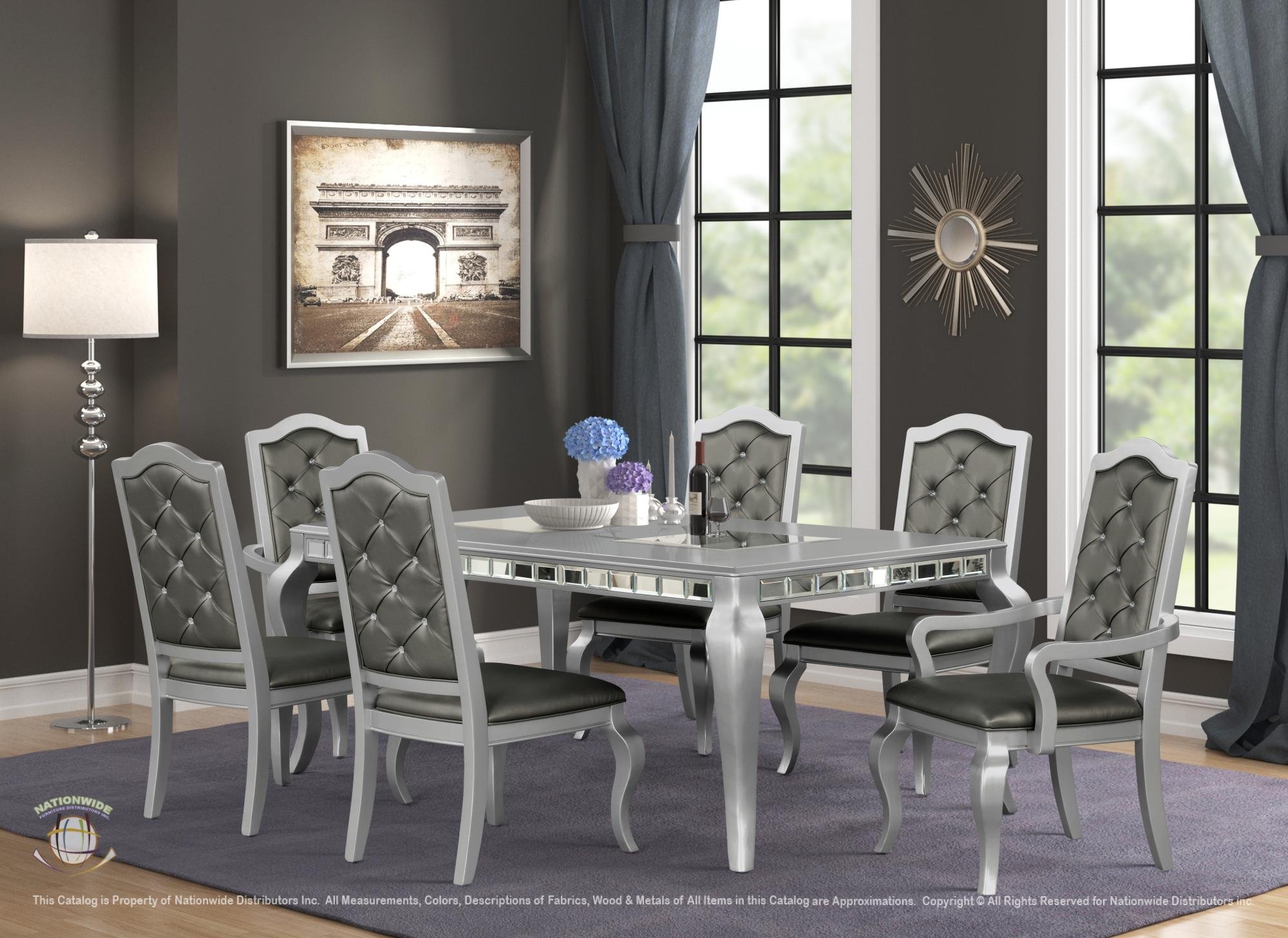A modern dining room with a silver and black dining table and six matching chairs. Large windows with dark curtains, a wall mirror, artwork of the Arc de Triomphe, a floor lamp, and a purple area rug.