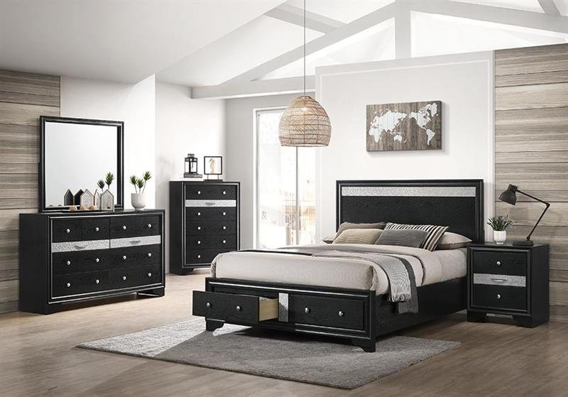 Modern bedroom with black furniture, including a bed, nightstand, and dressers, with decorative items and a wall map