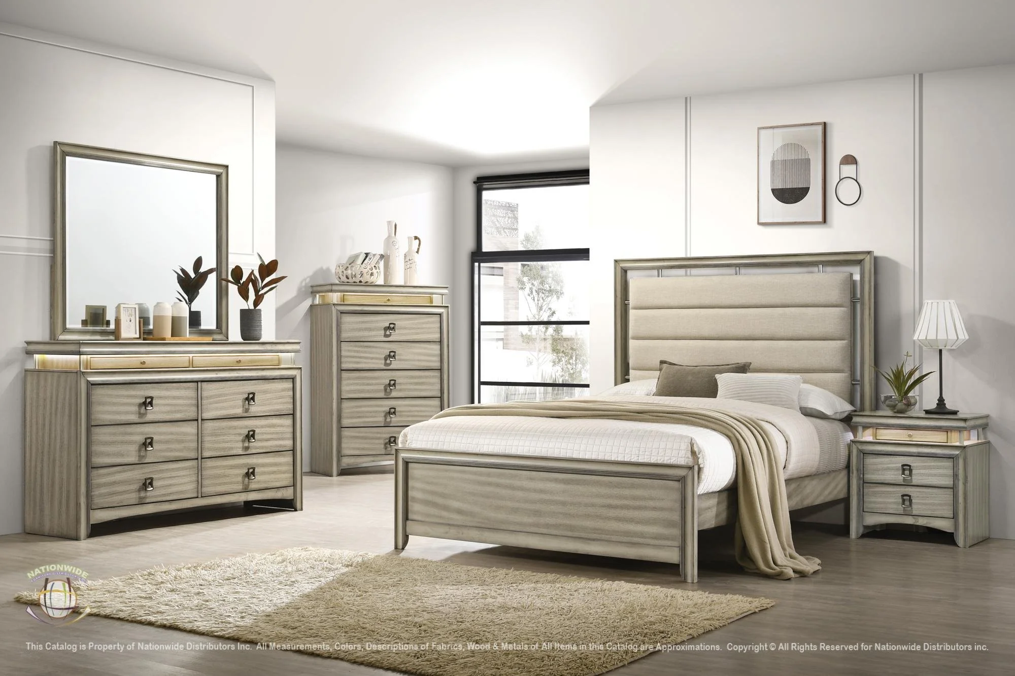 A modern bedroom with a bed, nightstand, dresser, and chest of drawers in neutral tones. Decor includes a mirror, plants, artwork, and a table lamp, with light coming through a large window.