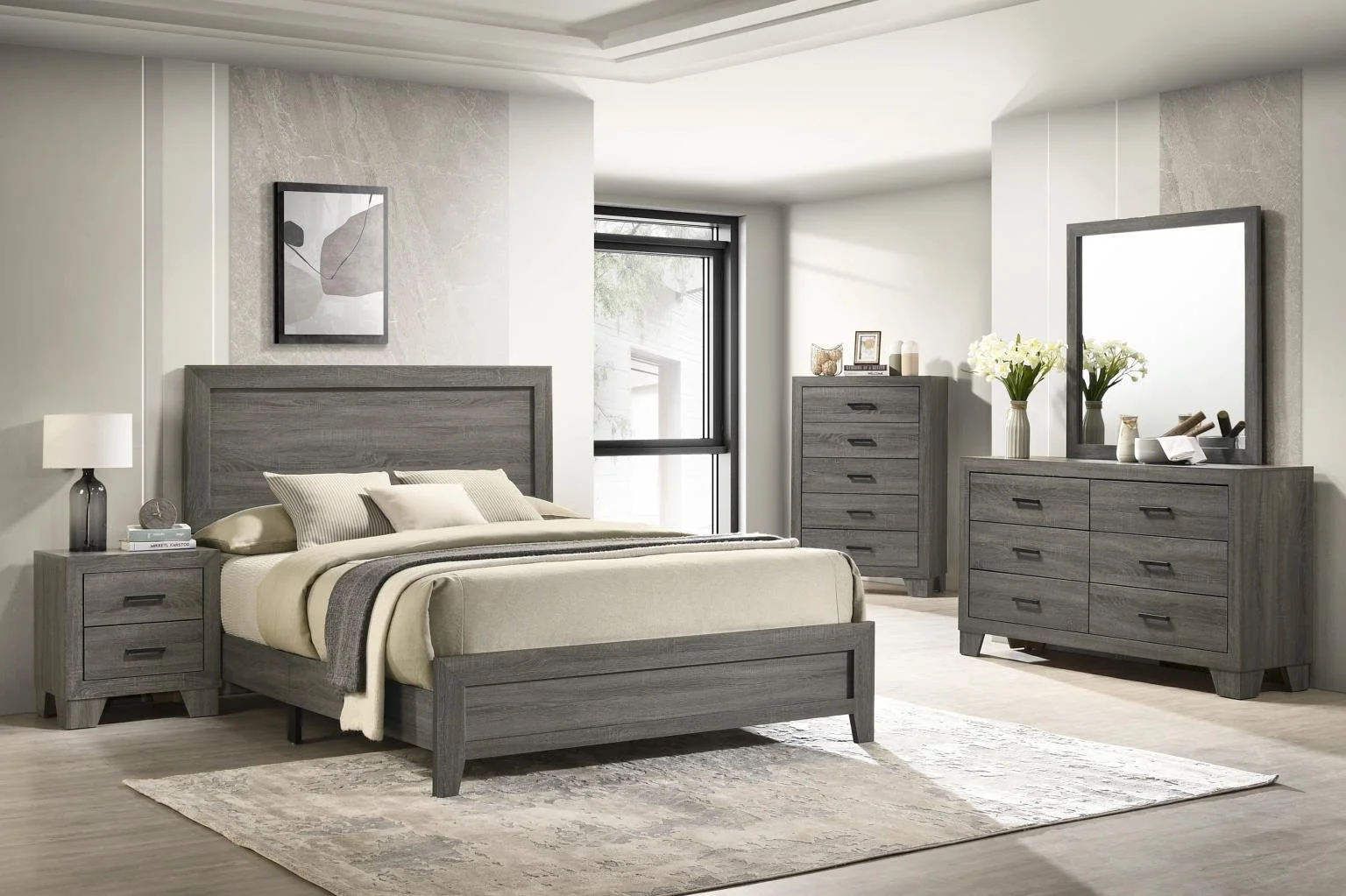 A modern bedroom furnished with a gray wood bed, nightstand, dresser, and chest of drawers, decorated with vases, flowers, and framed pictures. There's a window, a rug, and minimalistic wall art.