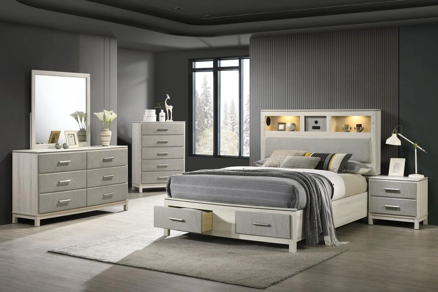 Modern bedroom with white furniture, gray bedding, decorative items, and natural light from a window.