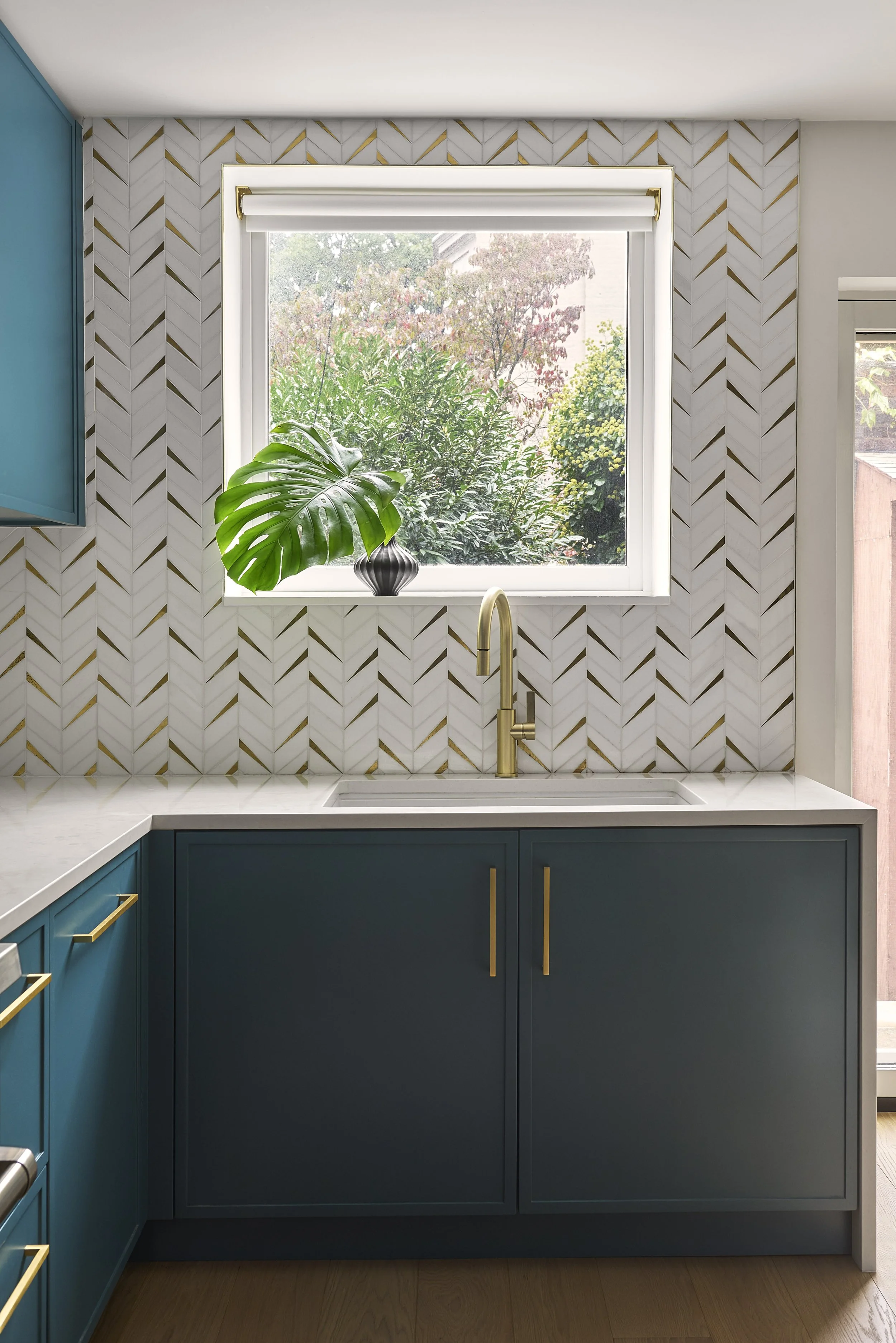 kitchen with custom mosaic tiled backsplash