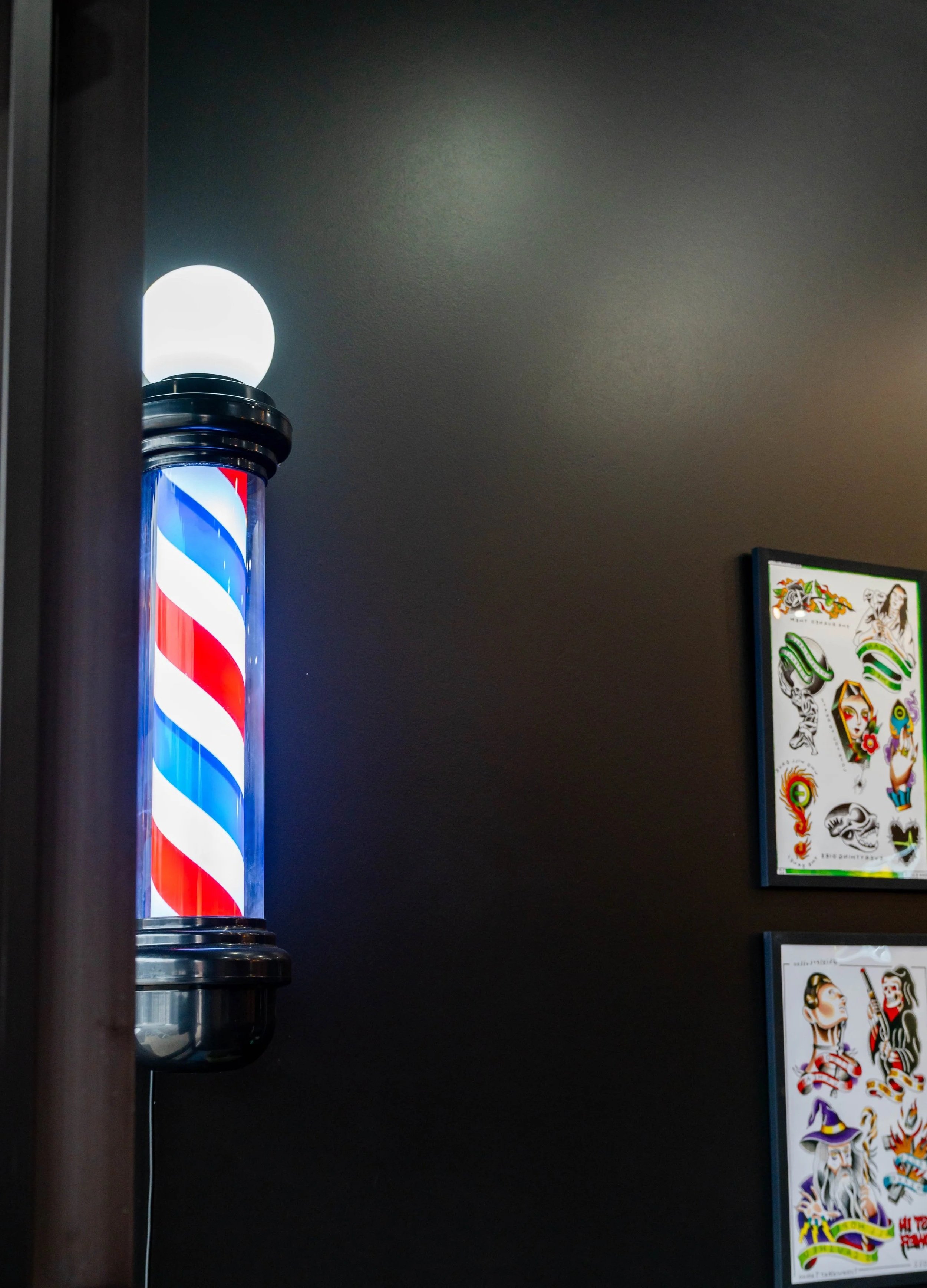 Barber pole inside Rebel Hearts Barbering barbershop in Brookside, Kansas City