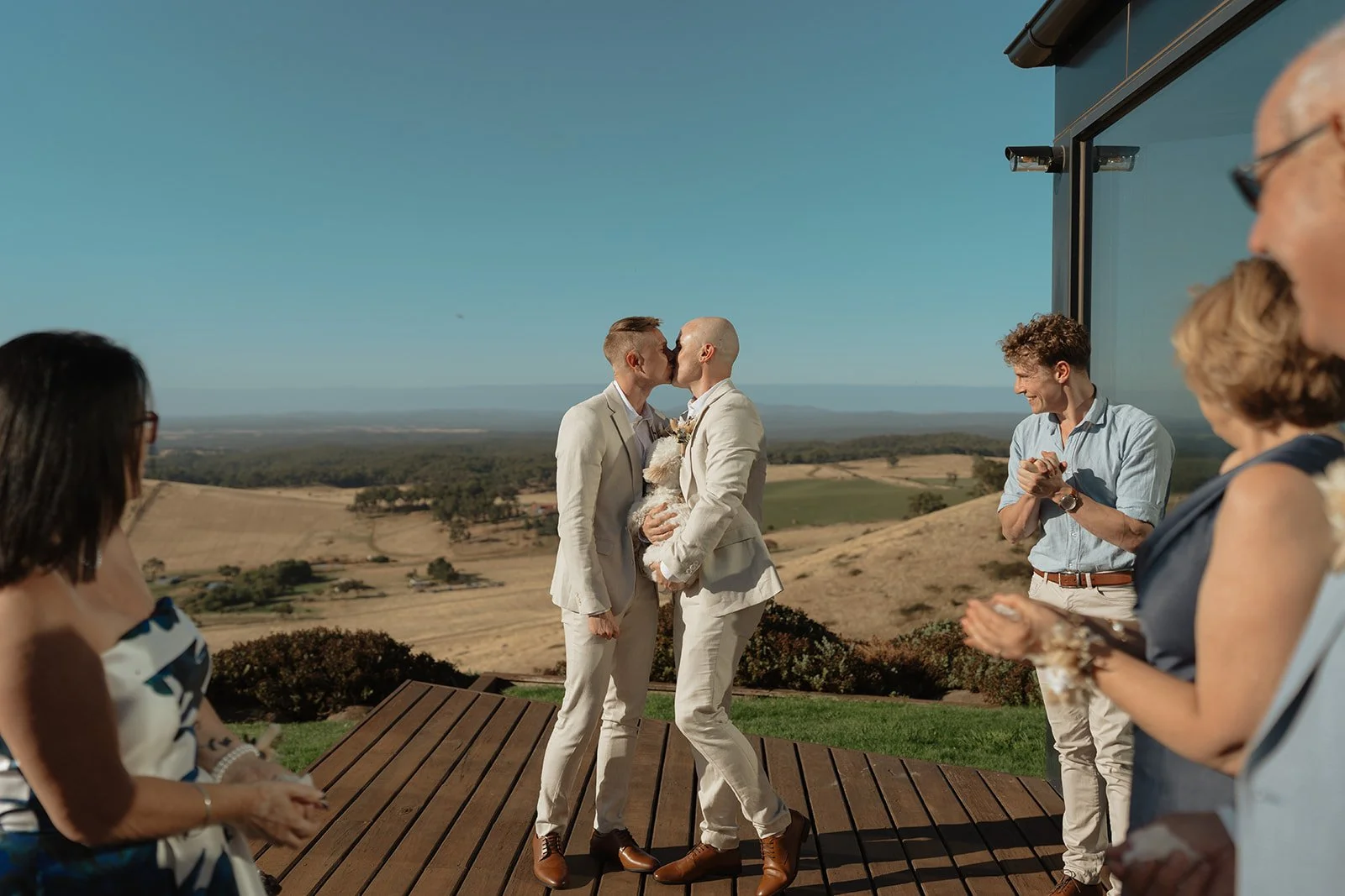 Laurie’s customers, Evan and Kade, running down a mountain after getting married. 