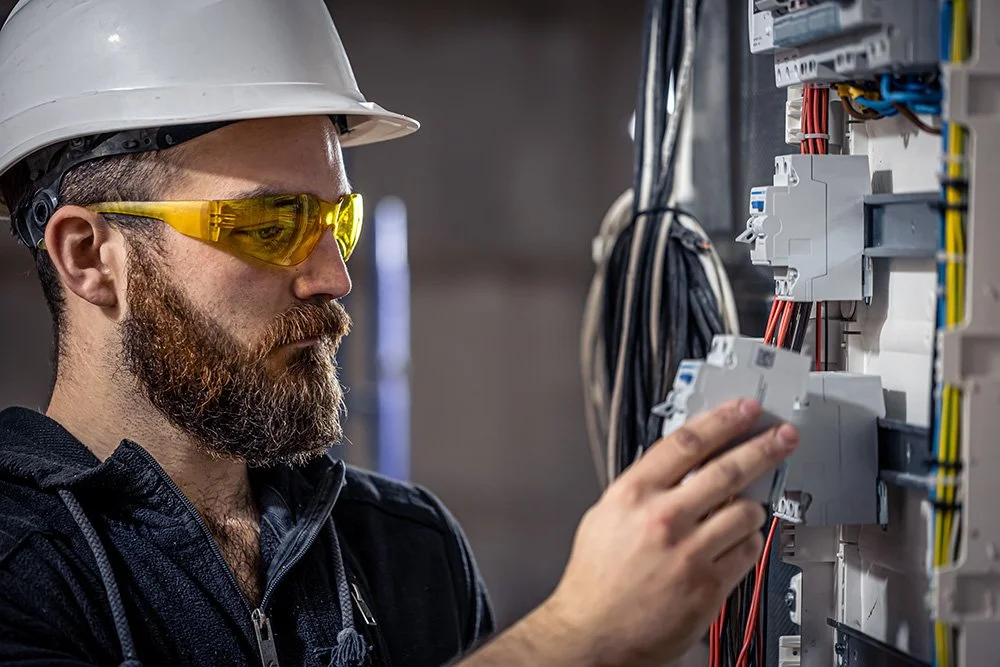 a-male-electrician-works-in-a-switchboard-with-an-2025-03-13-03-04-43-utc.jpg