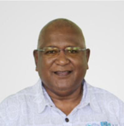 Portrait of a smiling man wearing glasses and a light-colored shirt.