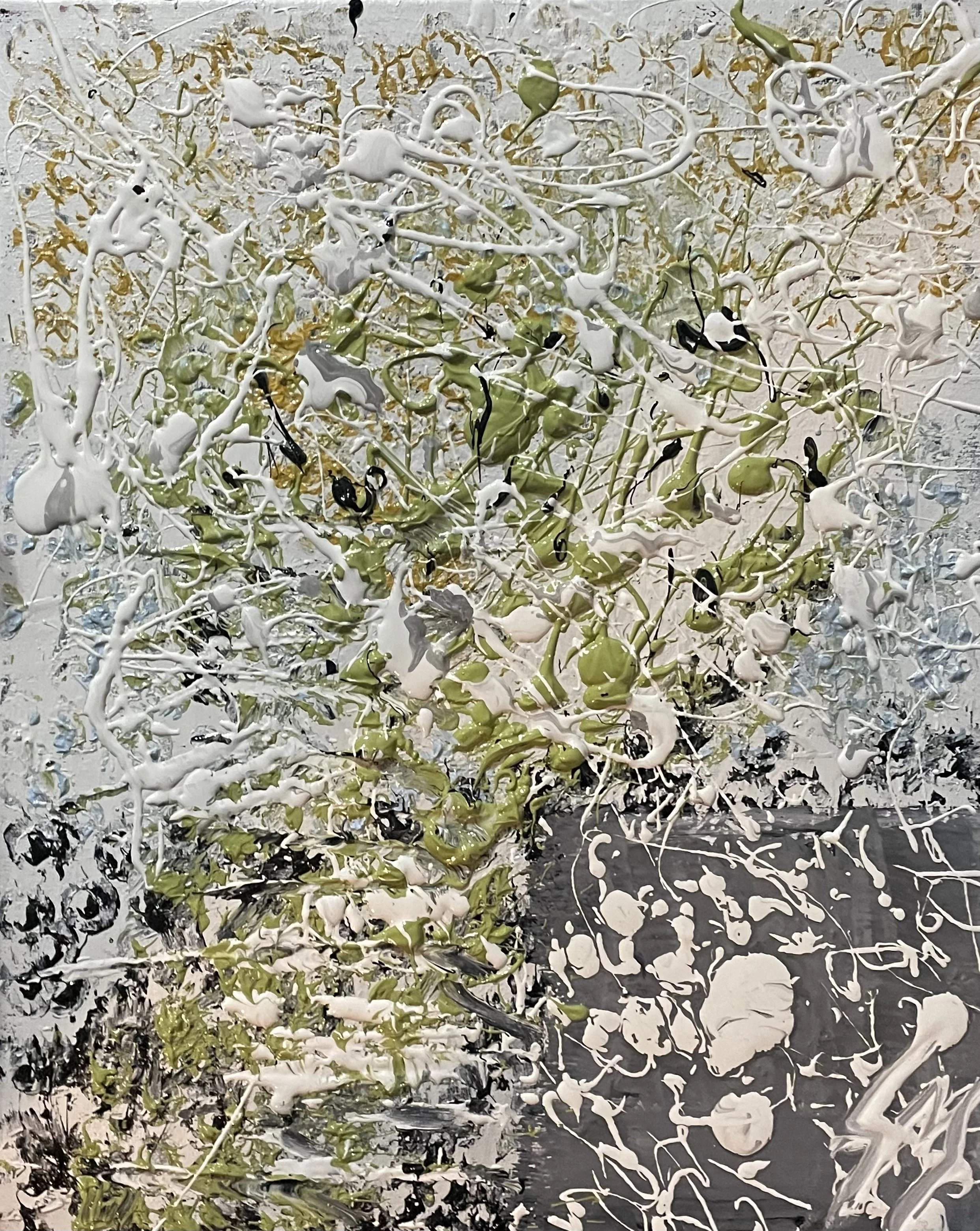 Abstract art with splatters of white, black, green, and gray paint in a chaotic pattern.