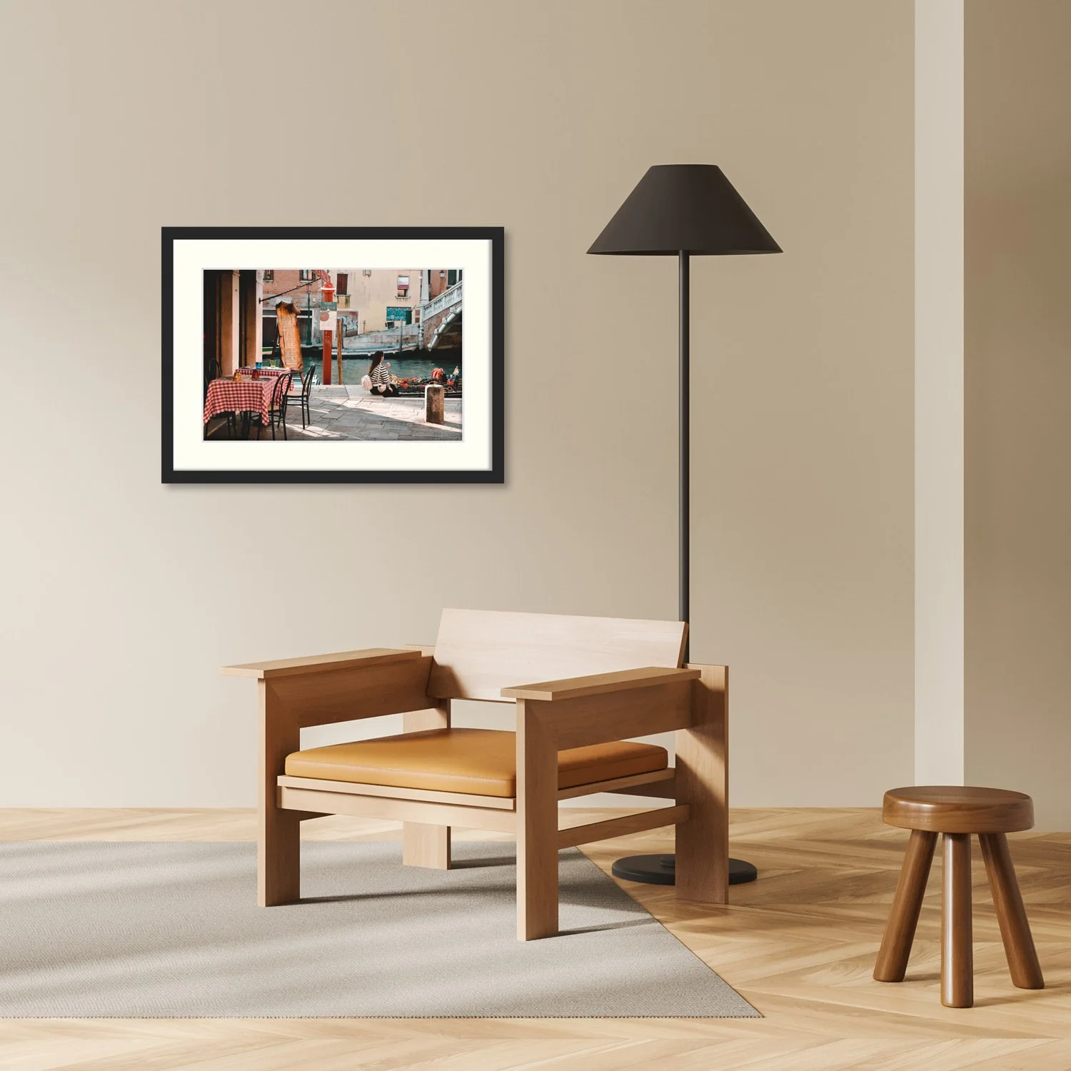 The Quiet Moment in Venice print is shown framed in in a minimalist black frame in a modern interior setting.