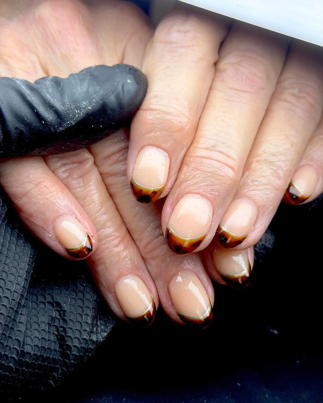 A French tip, but with a twist 🤎
Classic shape, finished with tortoiseshell tips for something a little different.

Nails by @rosie_generationsbeautynails 
Producst used @homeofnailart 

#nailscornwall #nailsaloncornwall #nailtechcornwall  #beautysa