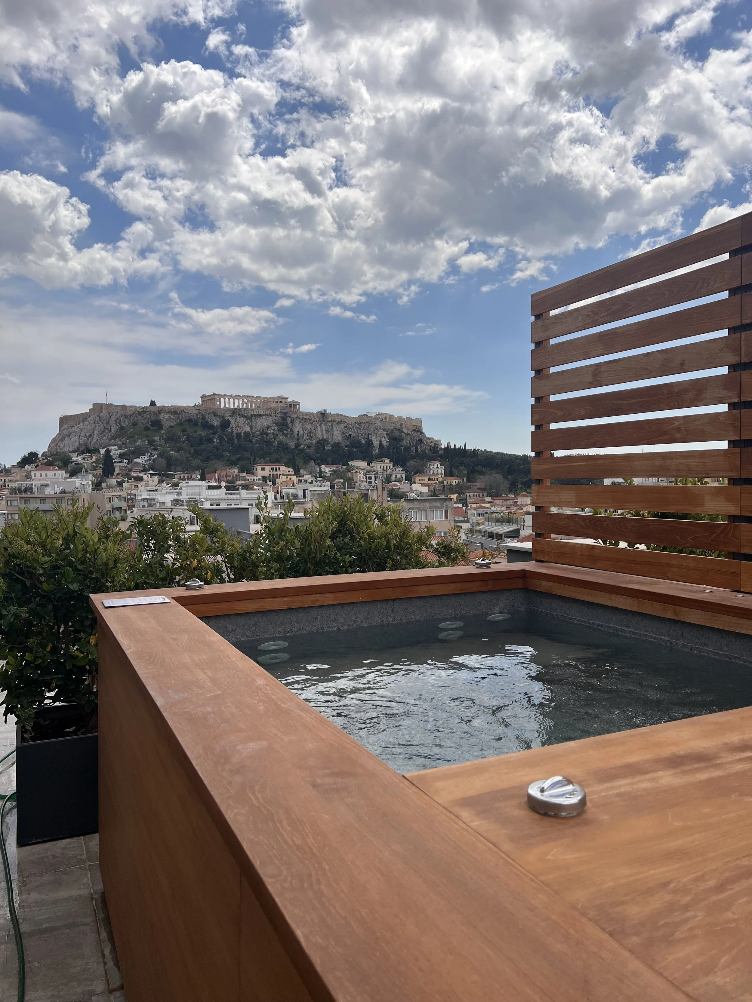 Luxury hotel balcony with a jacuzzi and a view of the Acropolis, personally scouted by Travel by Angela