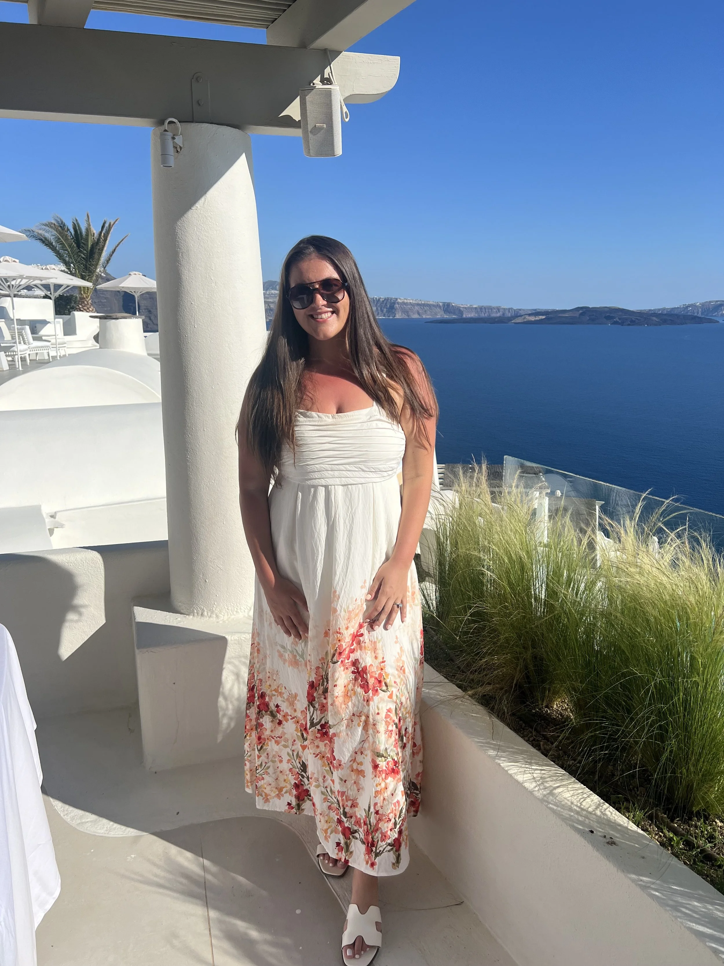 Luxury travel expert Angela enjoying the panoramic views of Oia, Santorini