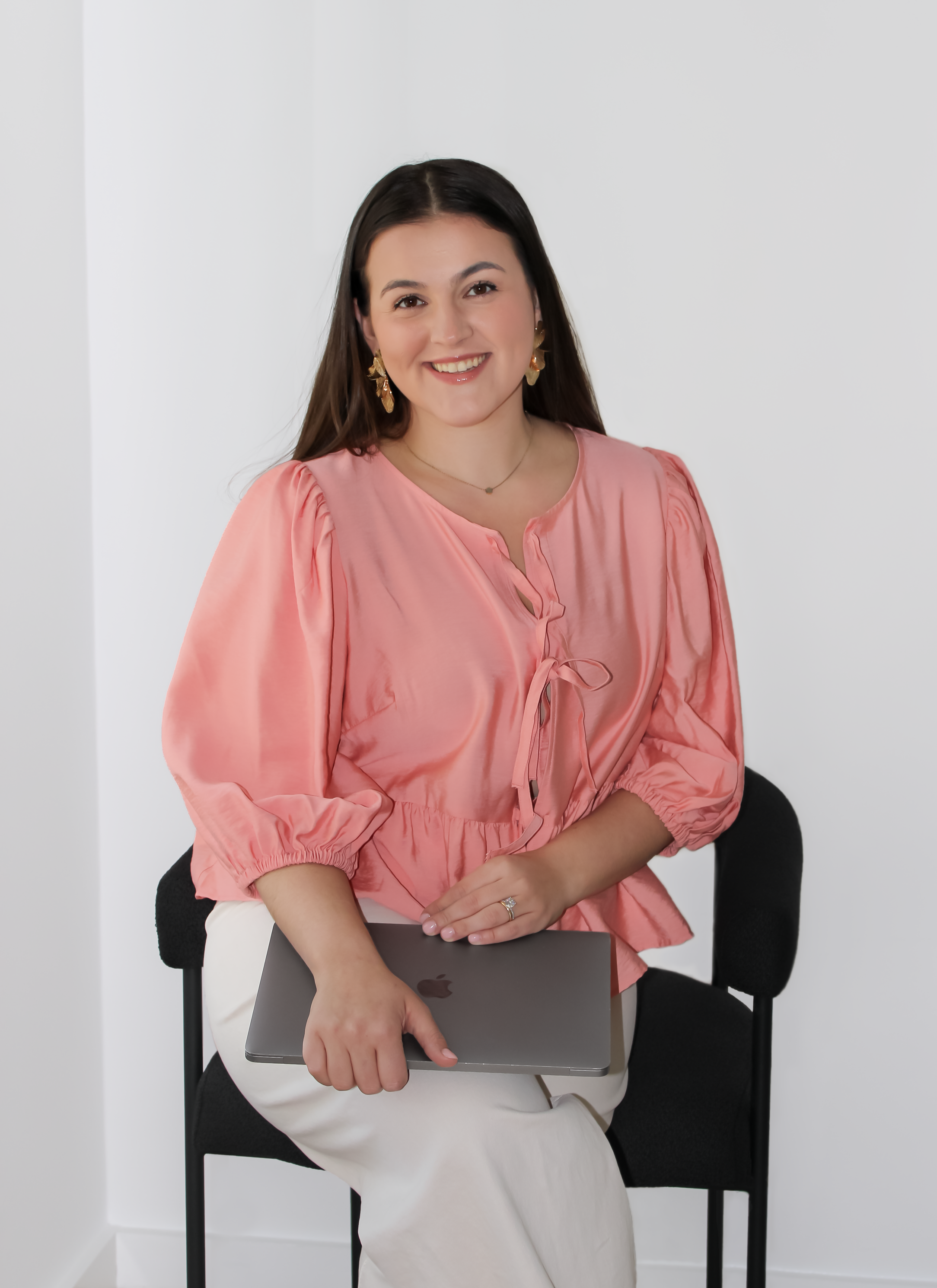 Angela, Luxury Travel Advisor and founder of Travel by Angela, smiling in a professional  portrait