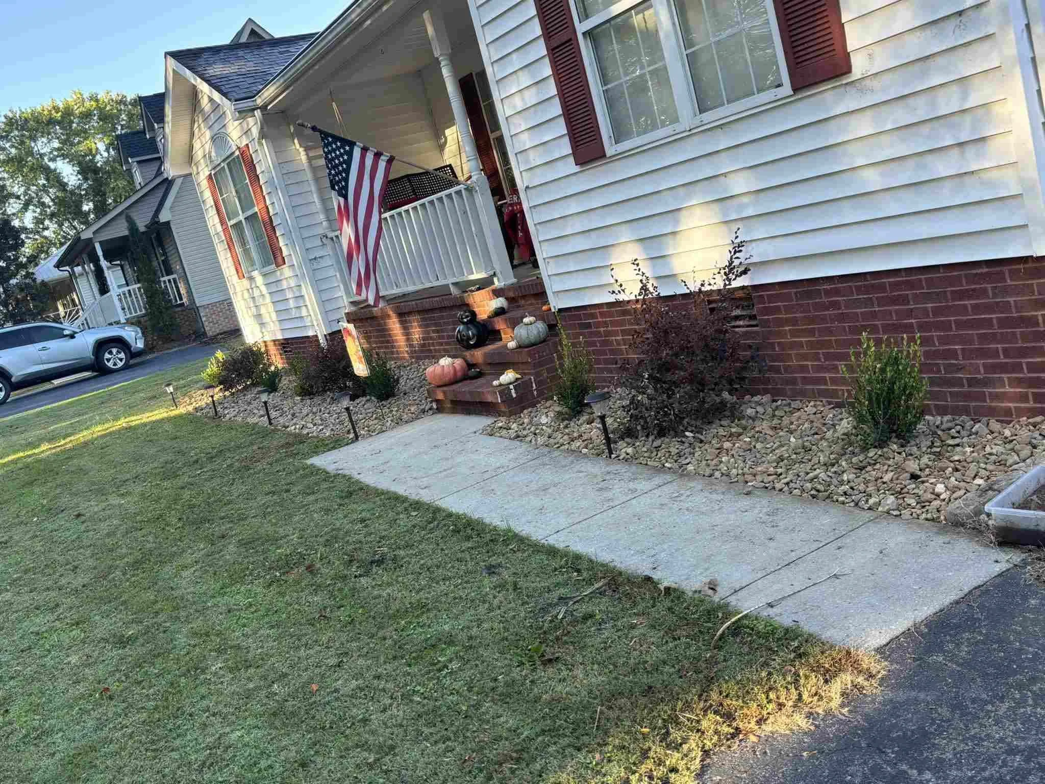 Finished residential landscaping with stone beds and clean edges in McMinnville, TN