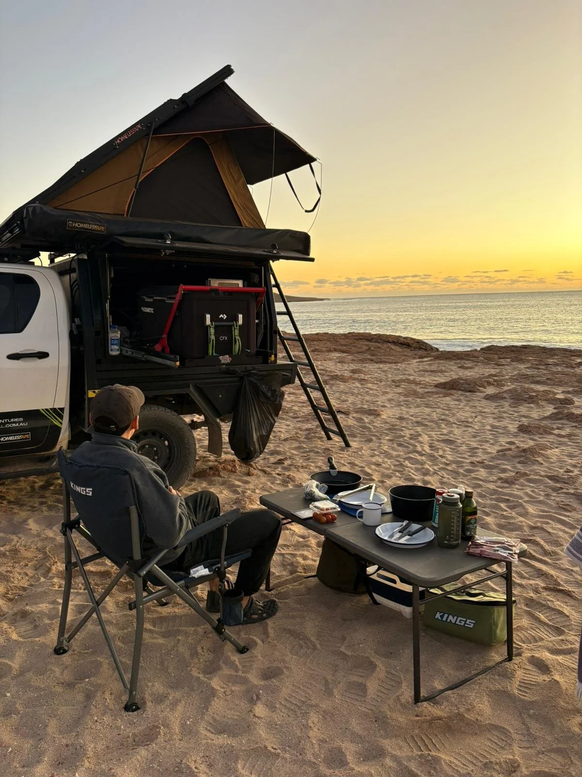 Oyster rooftop-tent camper overlooking turquoise WA waters, showcasing premium off-road capability for travellers searching for Perth campervan hire near me.