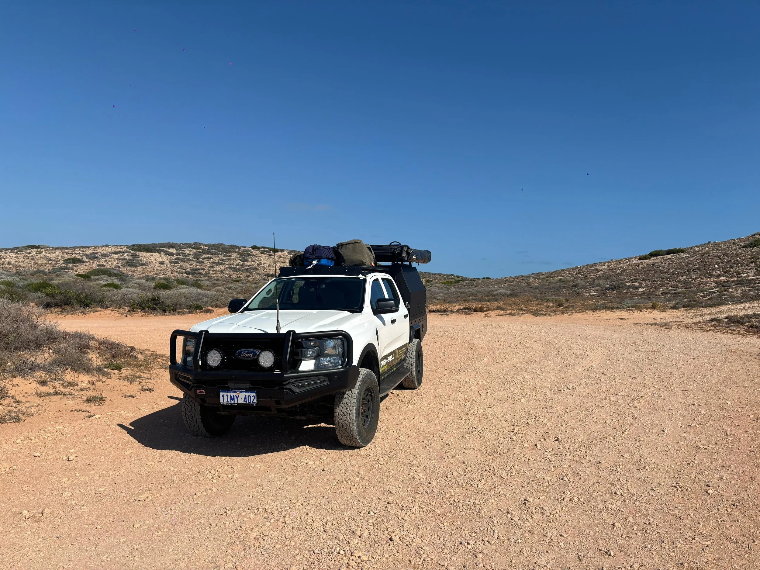 Fully equipped 4WD campervan for hire near me with fridge, awning and rooftop tent.