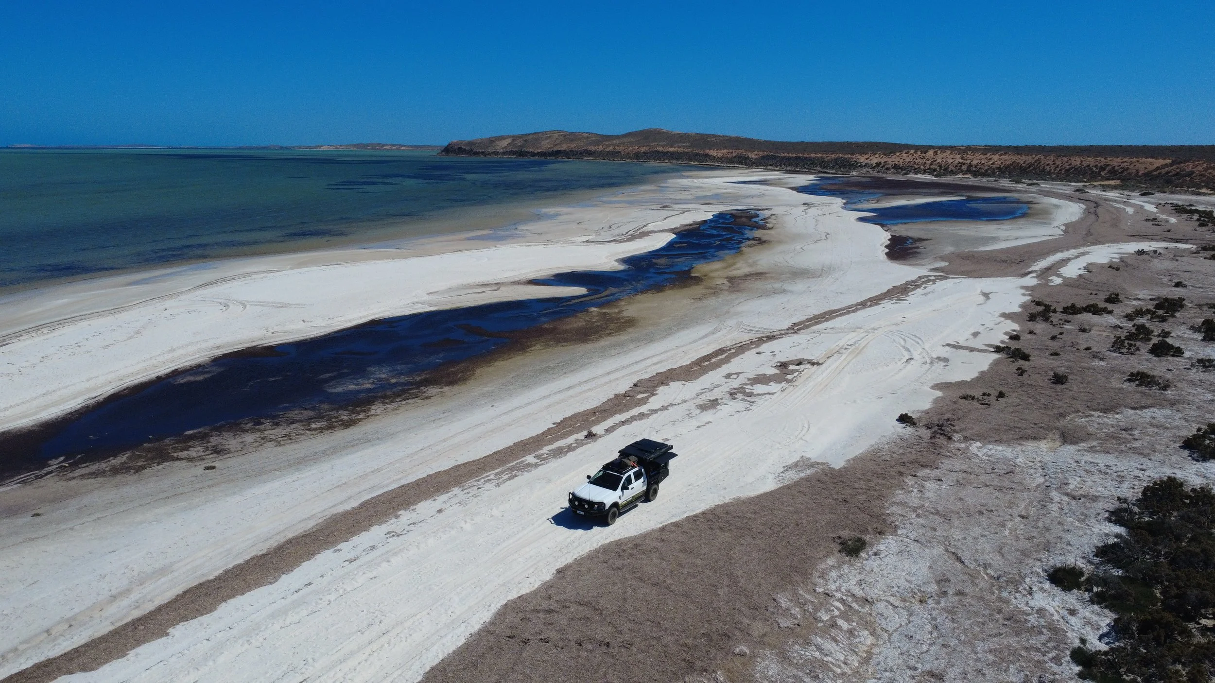 Fully equipped Oyster 4WD camper positioned beside a forest track in WA’s southwest, ideal for nature lovers booking off-road campervan hire.