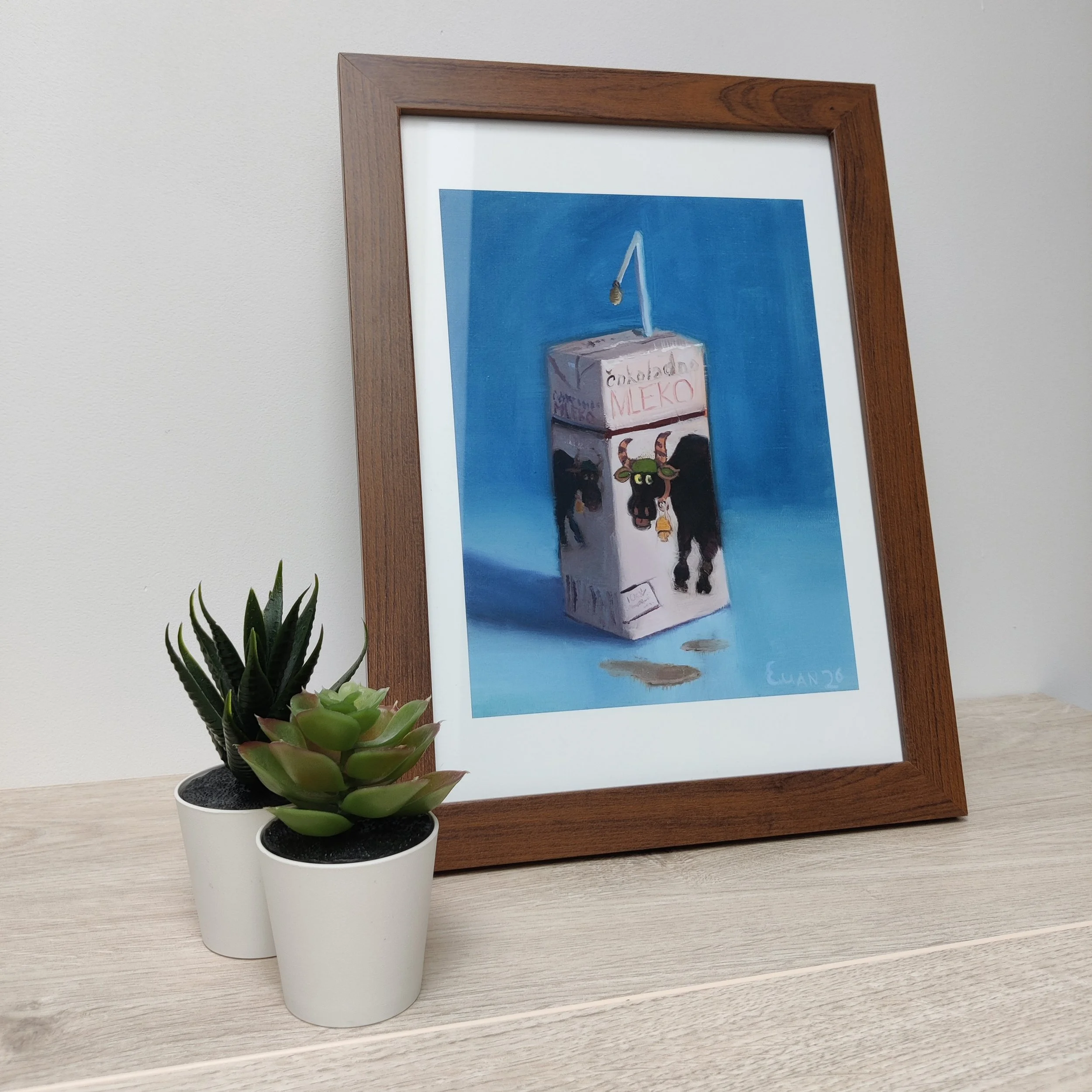 Mleko print in a frame
