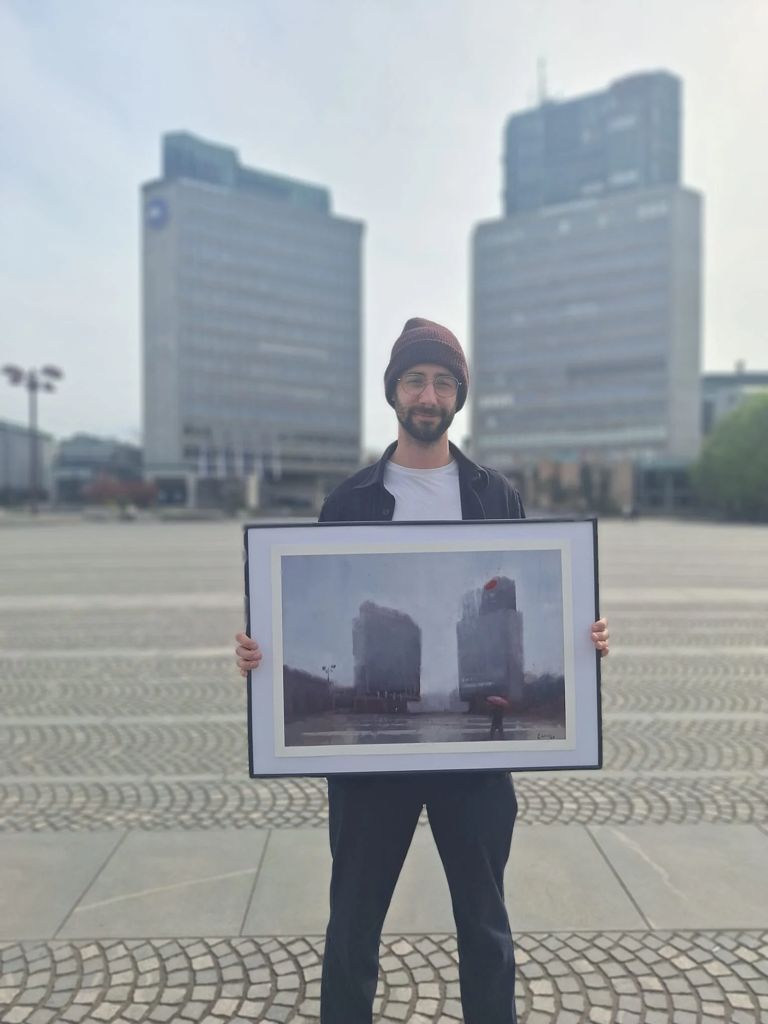 Holding the painting in front of Trg Republike