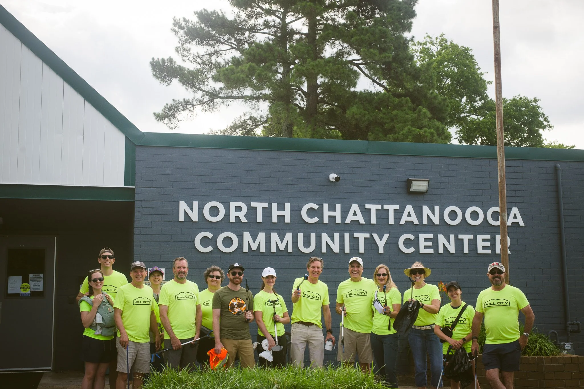 Hill City neighbors and Mayor Tim Kelly in front of the community center