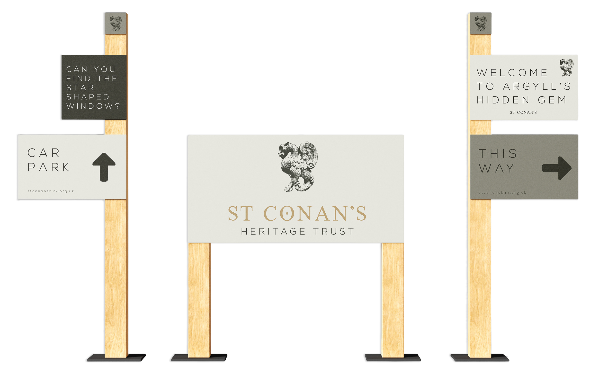 Signage for St. Conans Heritage Trust with directional signs and a central sign featuring a lion emblem.