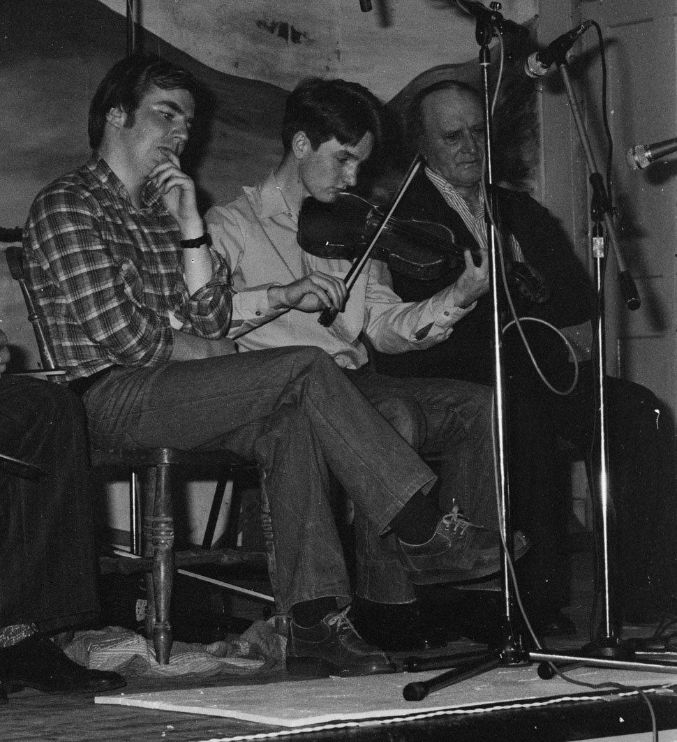 Dermot McLaughlin playing in the fiddle recital flanked by Tony Linnane (left) and John Kelly Sr. early 1980s.